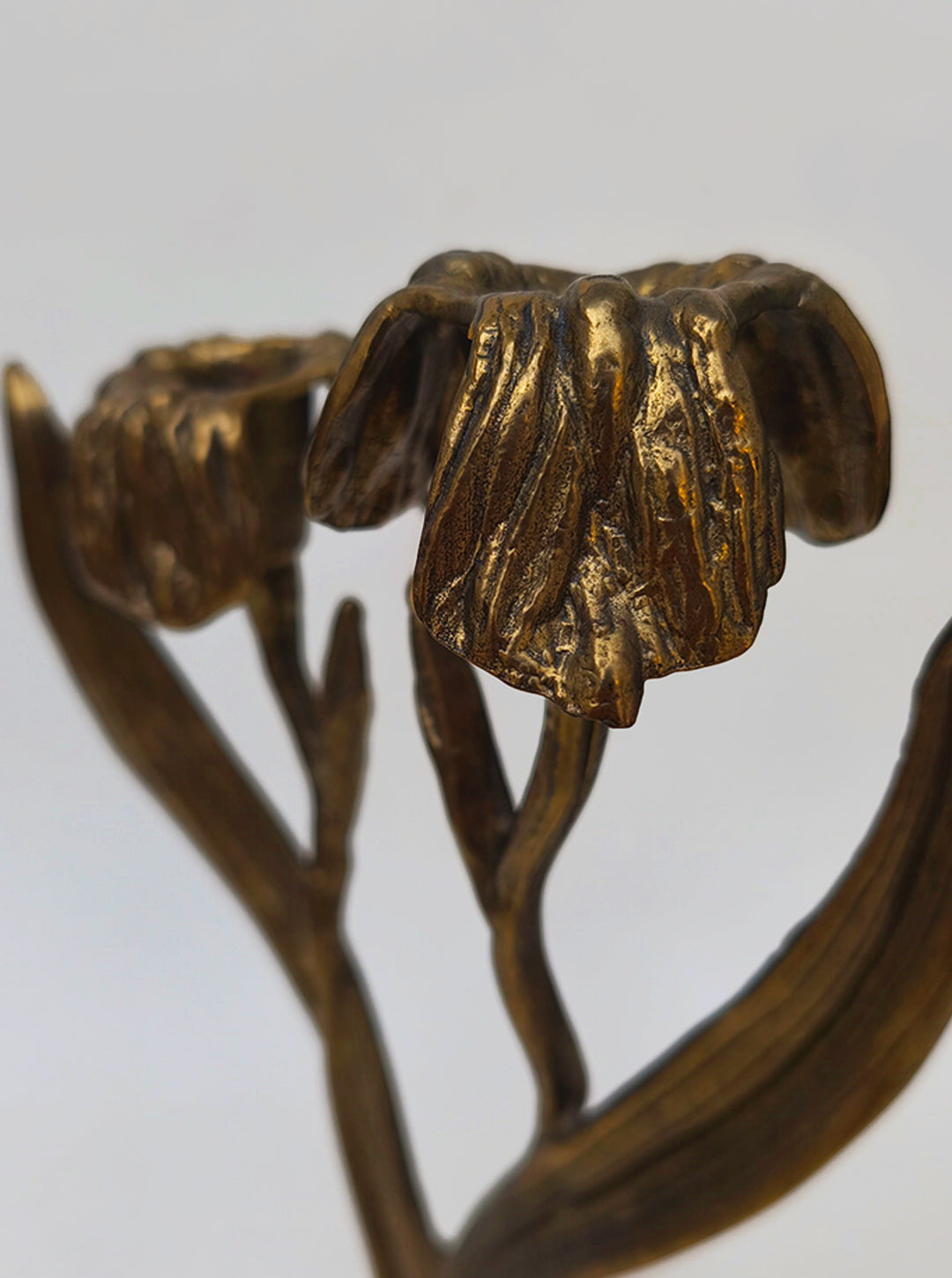 Art Nouveau Floral Candle Holder — close-up of textured brass flowers