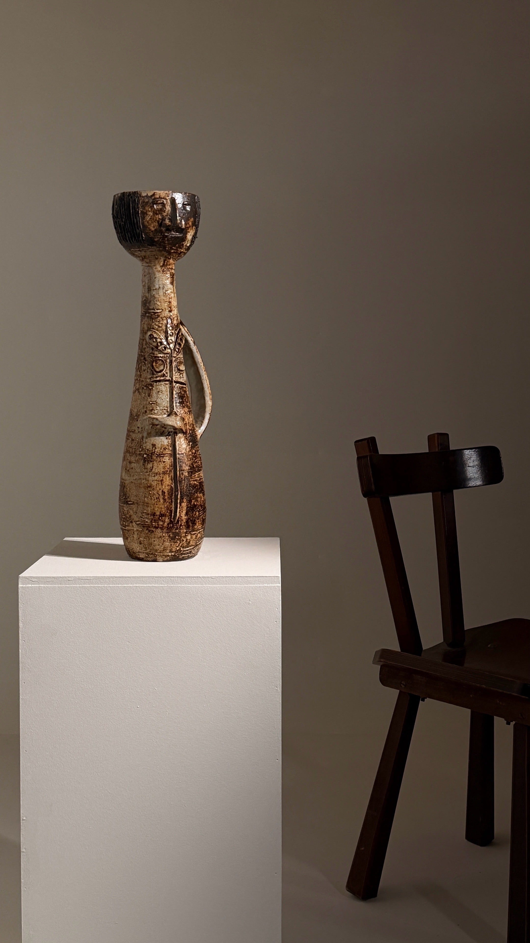 Monumental anthropomorphic pitcher by Jacques Pouchain — side view on white pedestal
