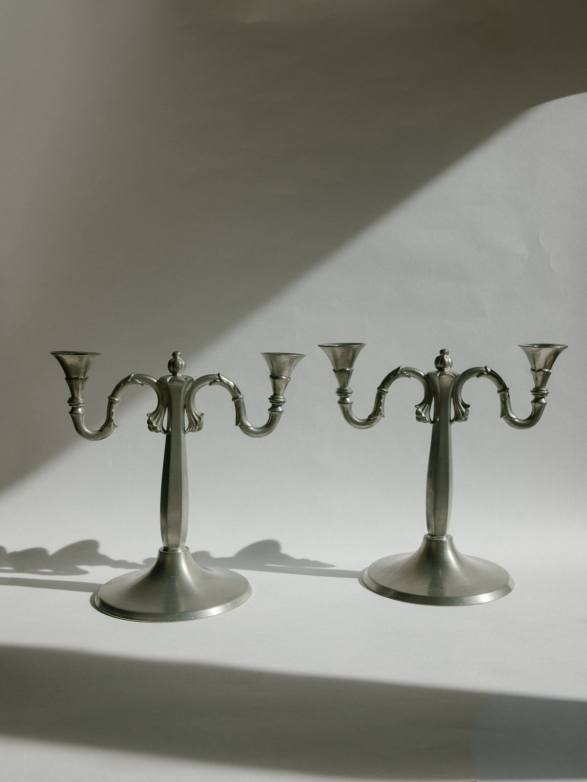 Pair of Harald Linder for Svenskt Tenn Swedish Grace Pewter Candelabra - 1930 by Trove Paris | The Oblist