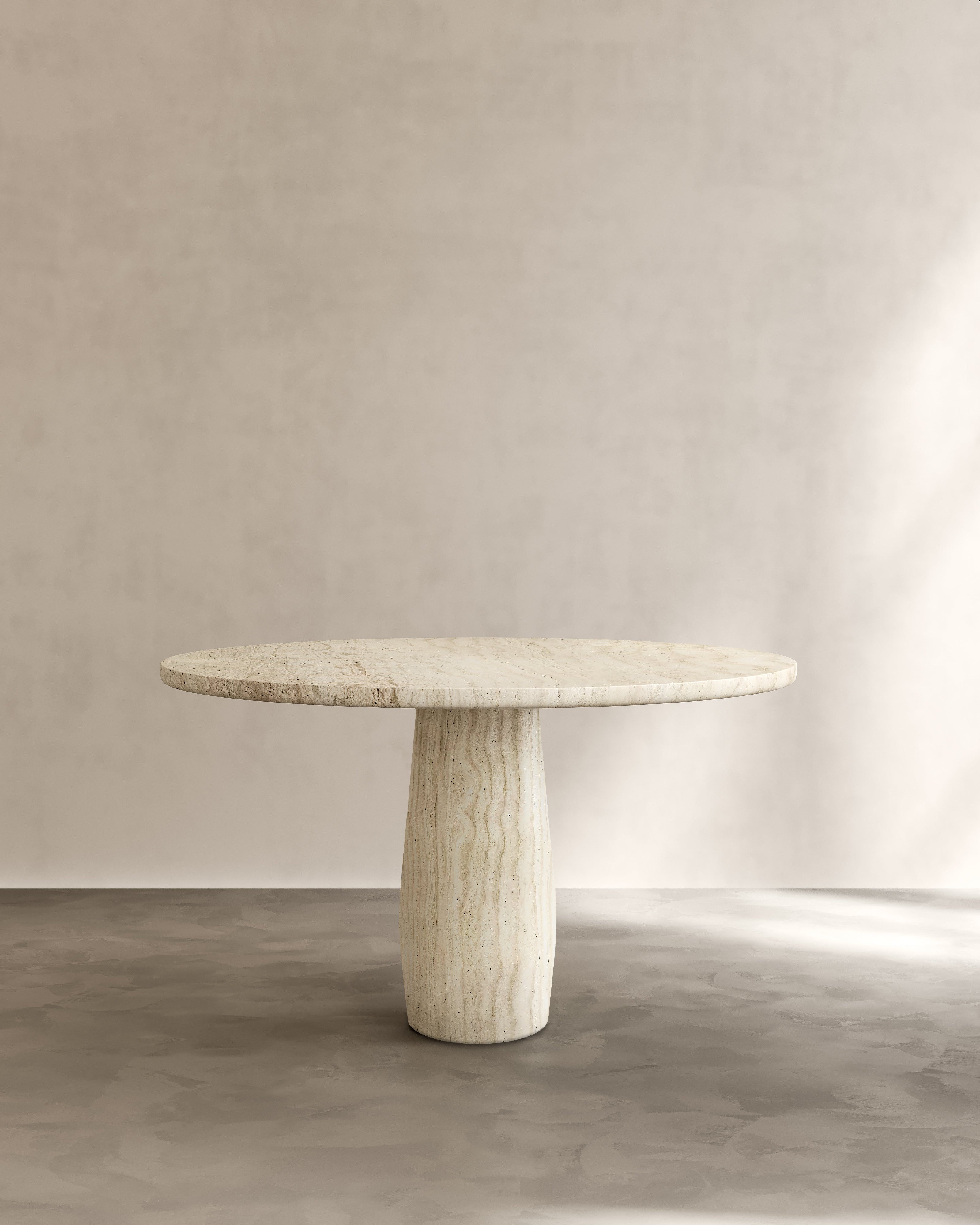 Raffaella Table II — top view of round stone dining table