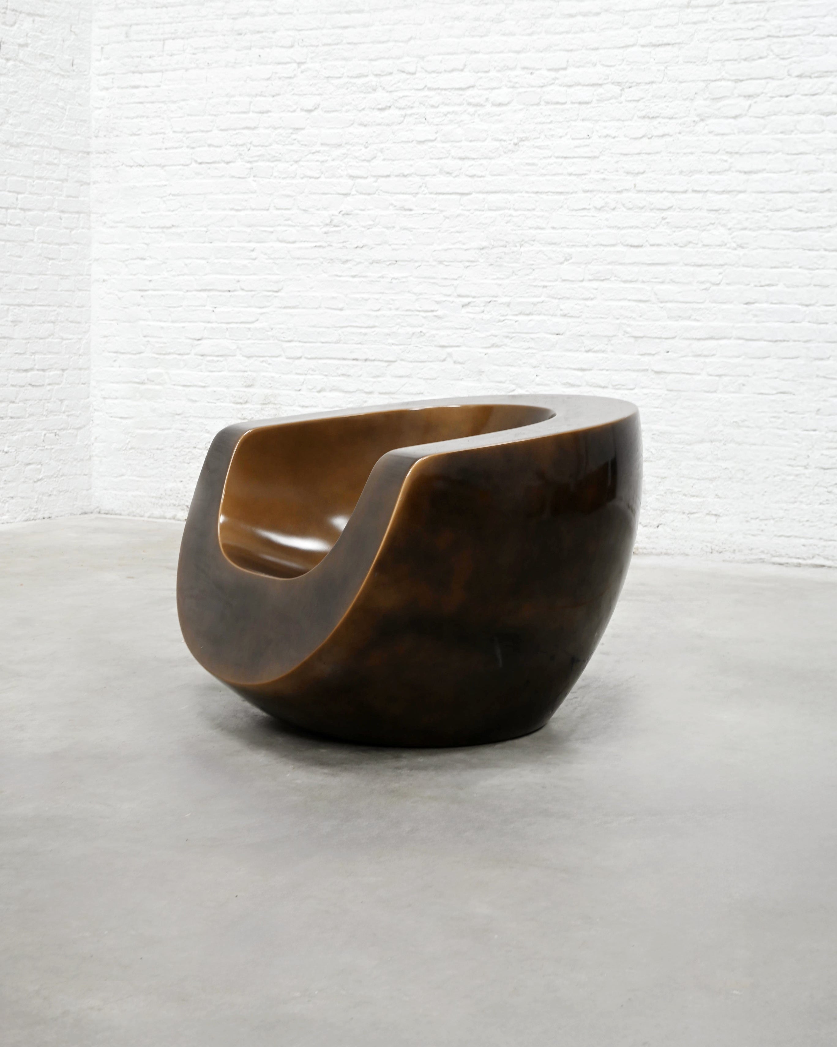 Brown sculptural Moon fiberglass armchair by Mike To, curved form