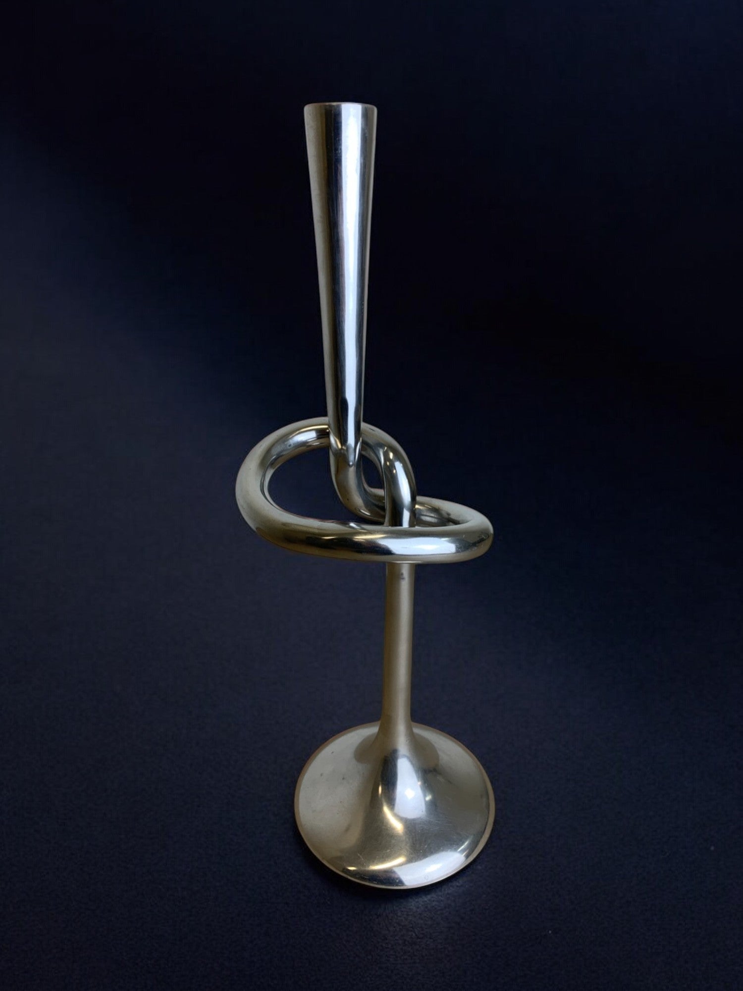XL knotted candlestick in Solid aluminum, Italy, 1980's — lifestyle setting