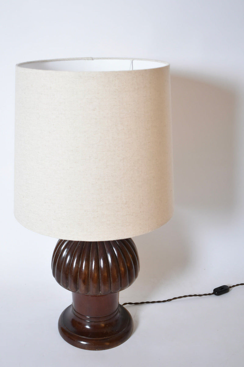The Pine Shape Wooden Lamp, 1930s by Barracuda Interiors features a beige fabric shade and dark brown ribbed base with visible black cord and switch on the right, all set against a white background.