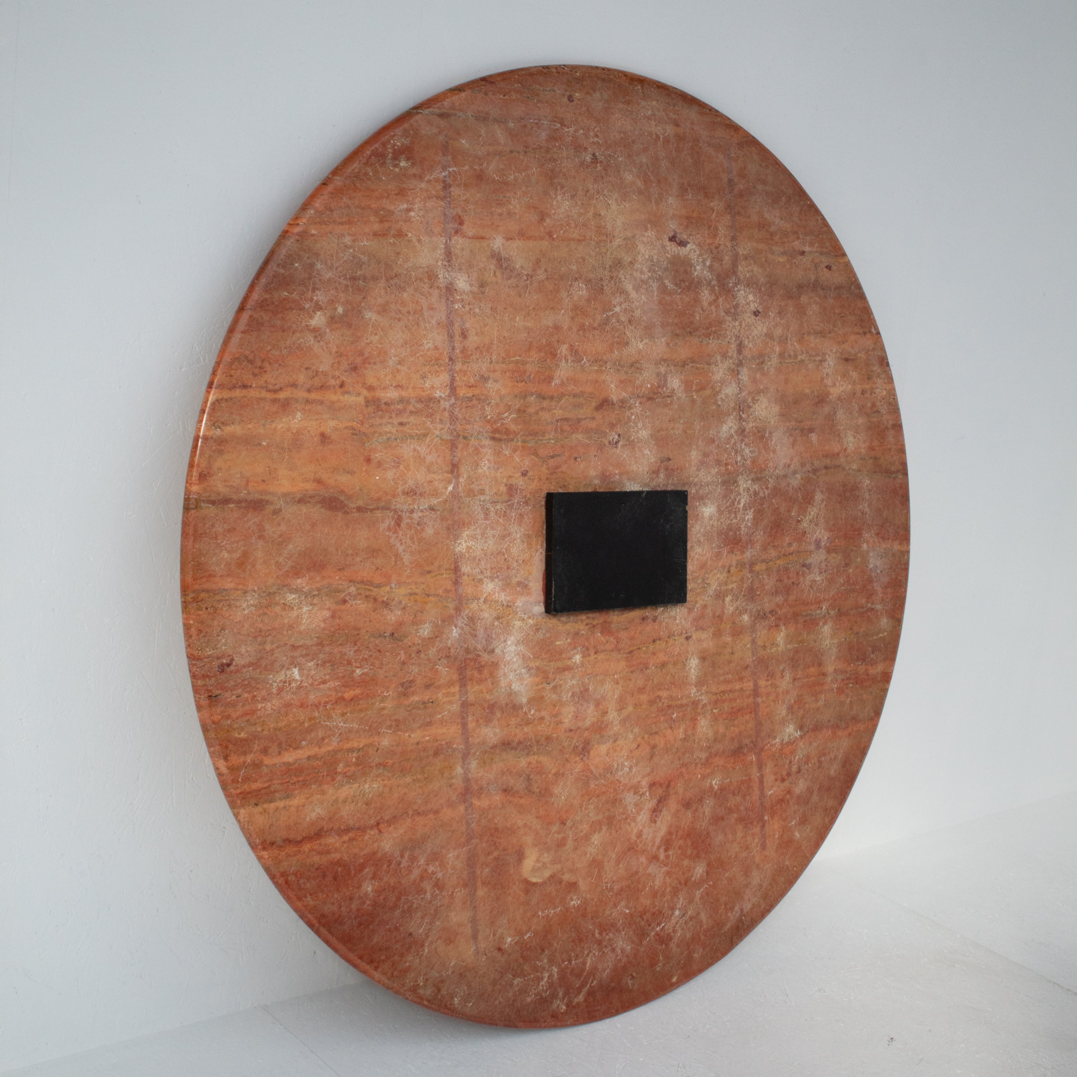 Round Dining Table in Rosso Travertino