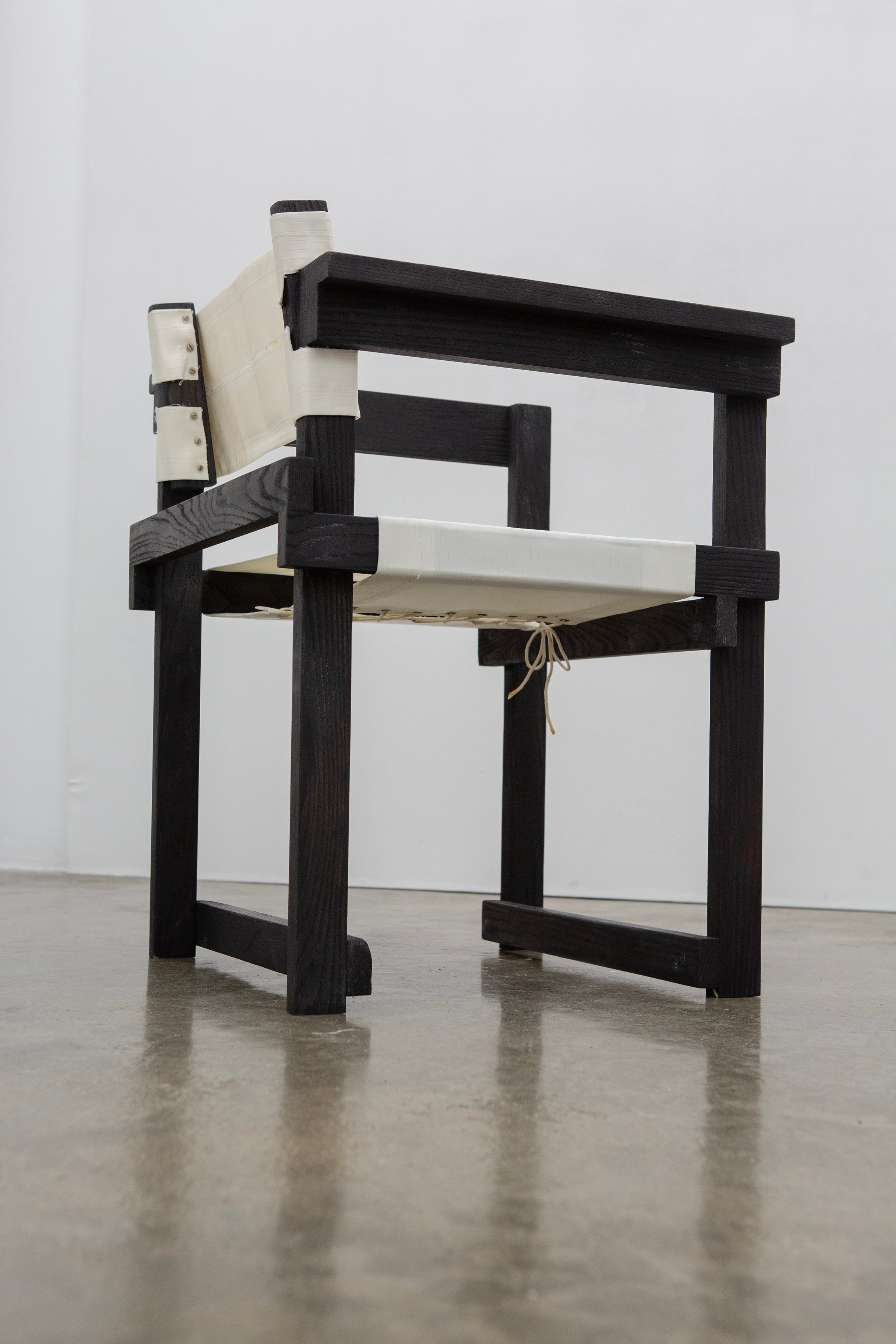 Modernist Dutch Chair after Gerrit Rietveld (1-6) — angled view showing black wooden frame and white seat