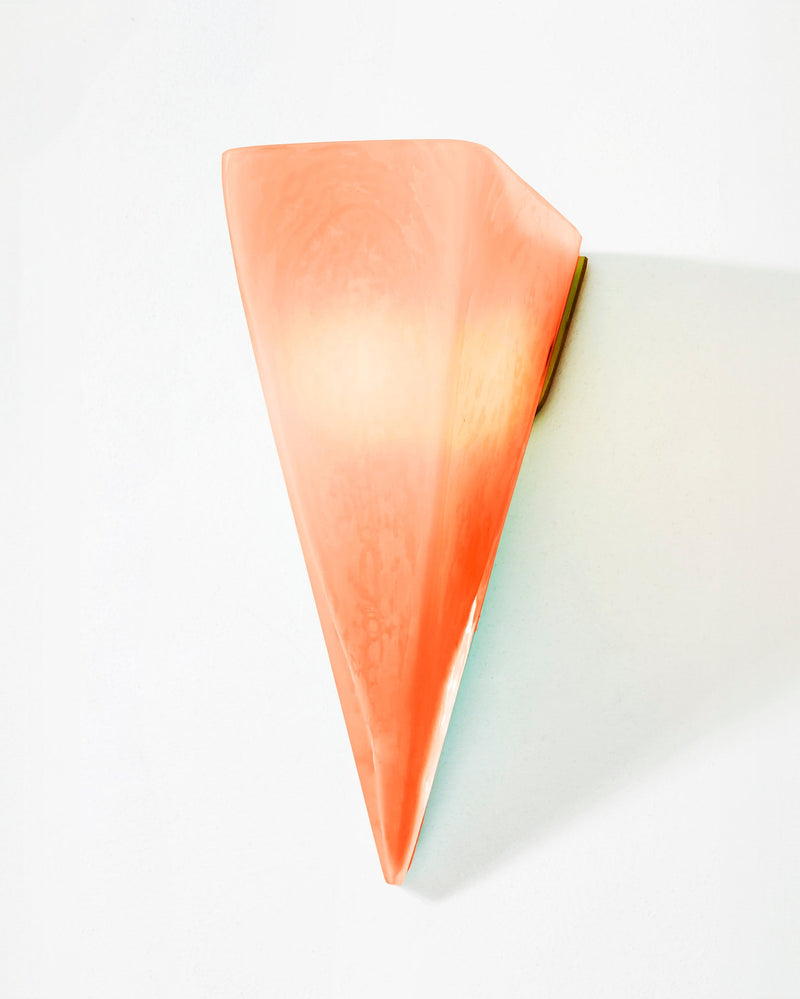 Hand blown glass sconce in coral pink quartz gradient profile view