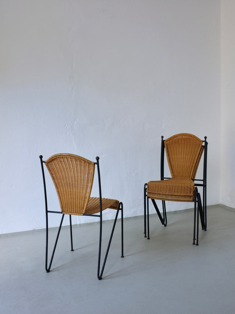 Two 1960s Frederick Weinberg wicker iron chairs with black frames