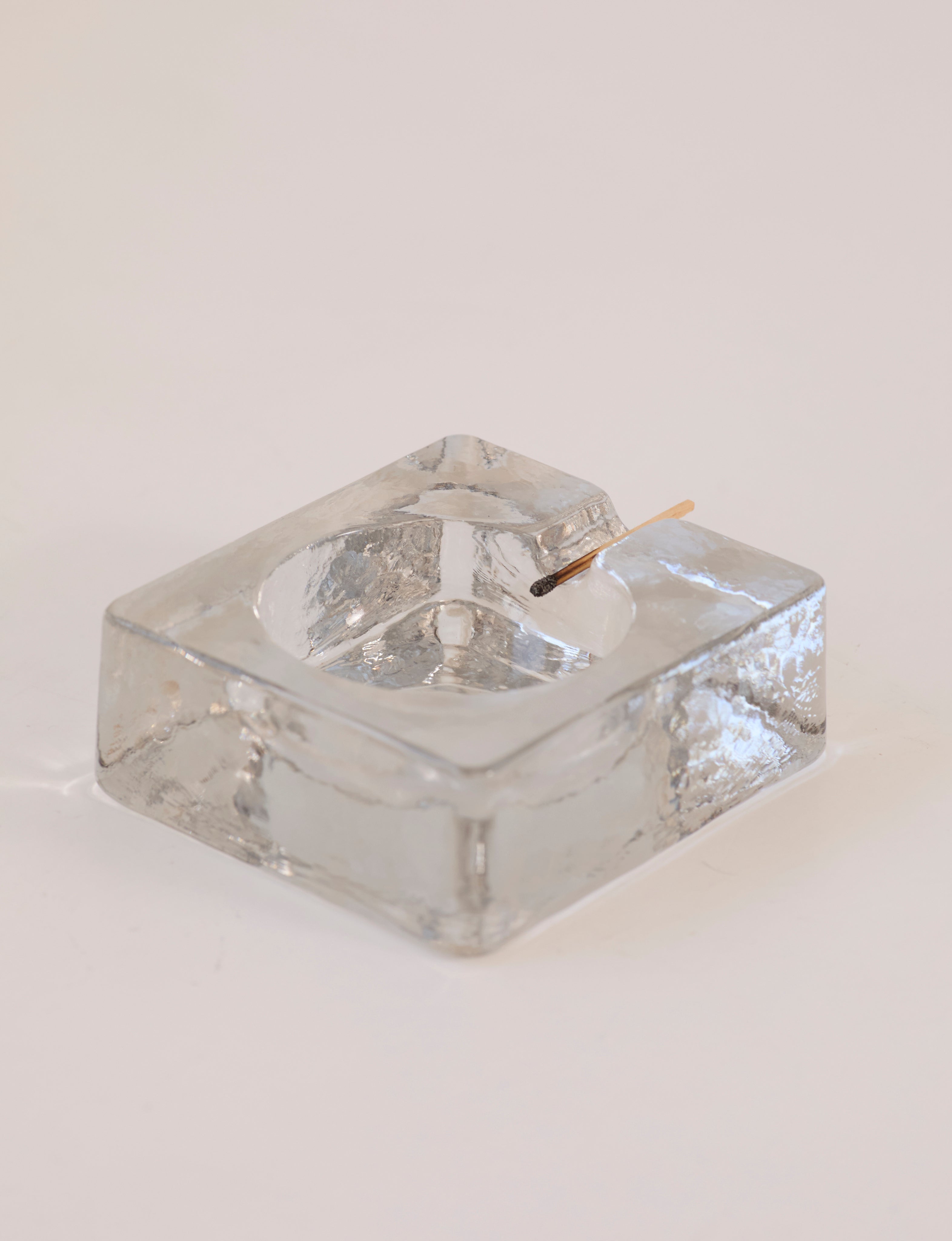 Scandinavian Clear Ashtray in Glass — angled view on white background