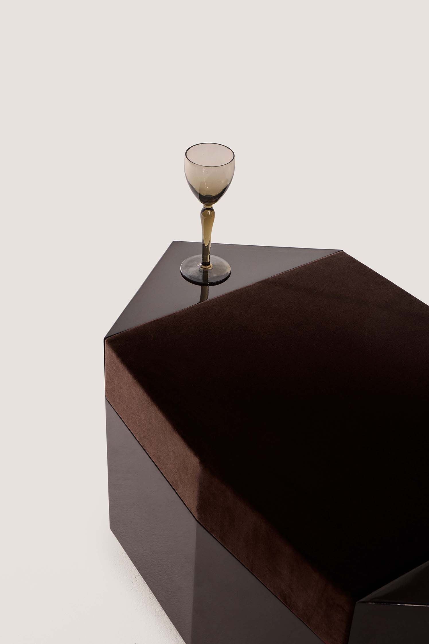 Ame I' Lacquer Ottoman — top view with dark velvet cushion and glass