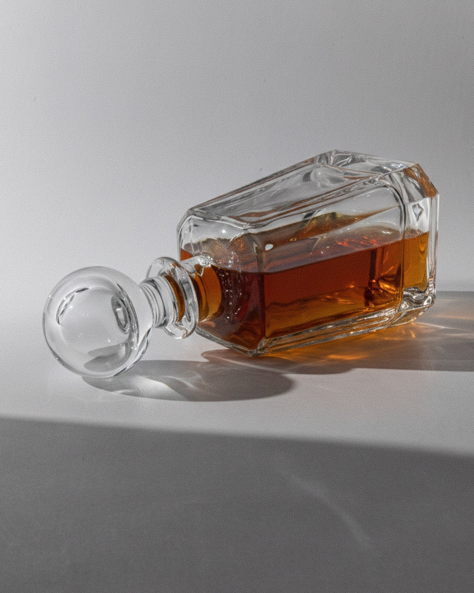1990s Murano Glass Decanter — side angle with amber liquid inside