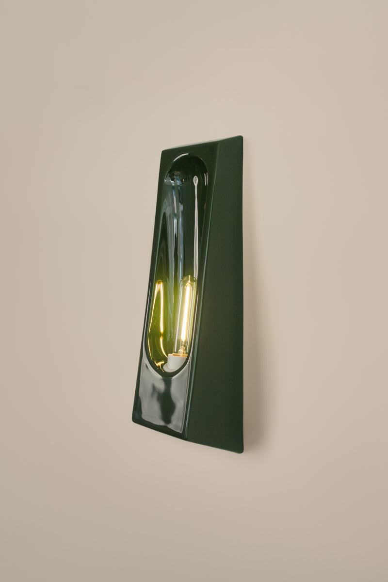 Alcove Verde — close-up of glossy green ceramic wall lamp
