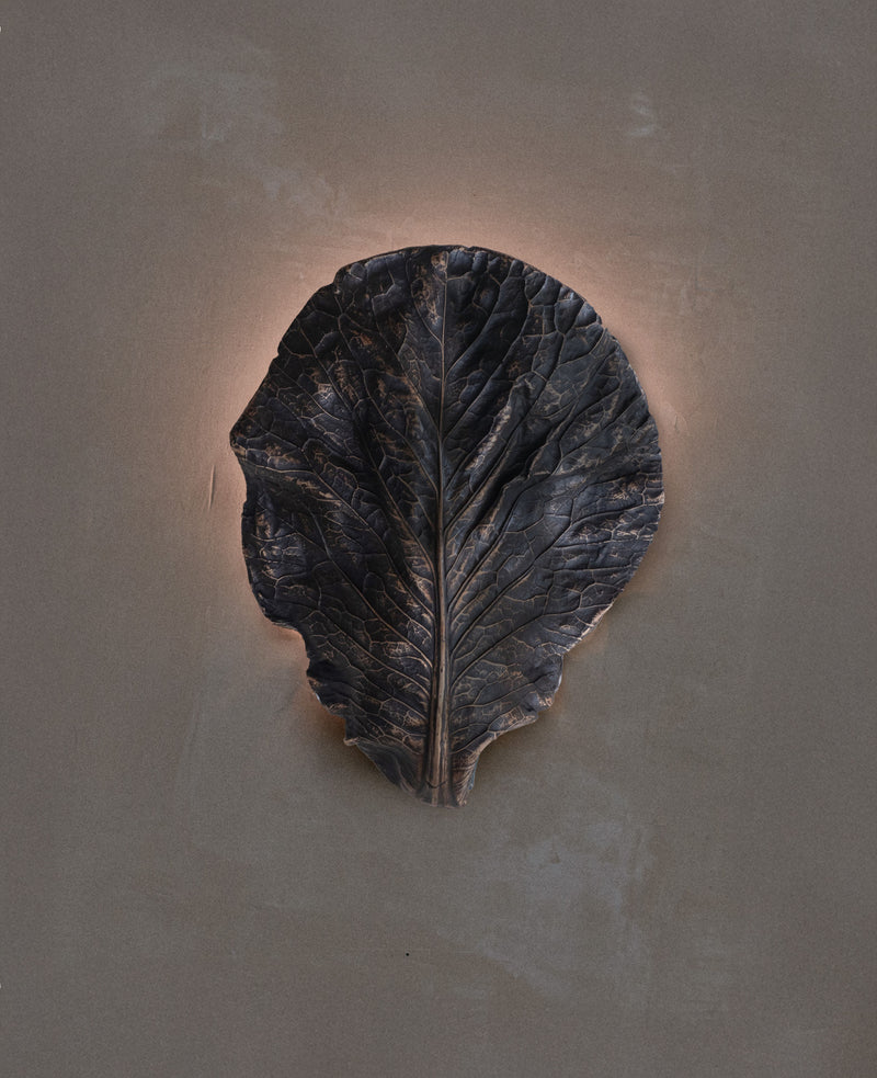 Bronze cabbage leaf wall light detail showing textured veining