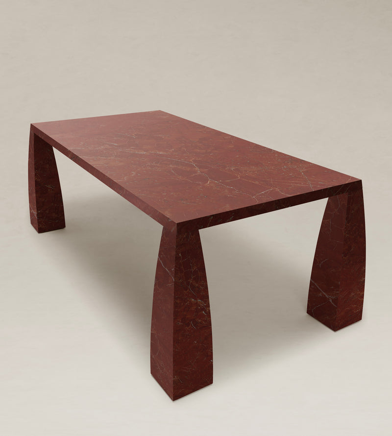 Khram Dining Table — close-up of red marble surface and angular legs