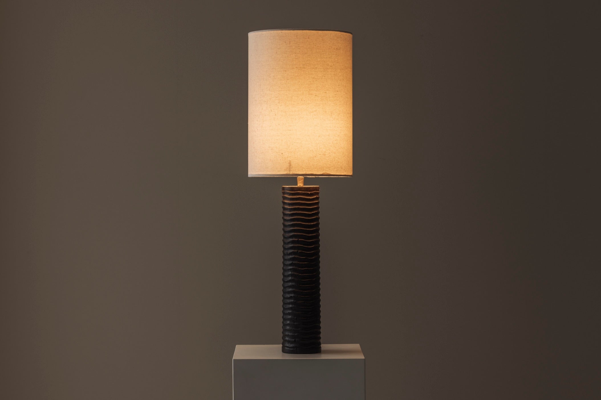 Elegant pair of French wooden carved table lamps from the 1970s. — in context