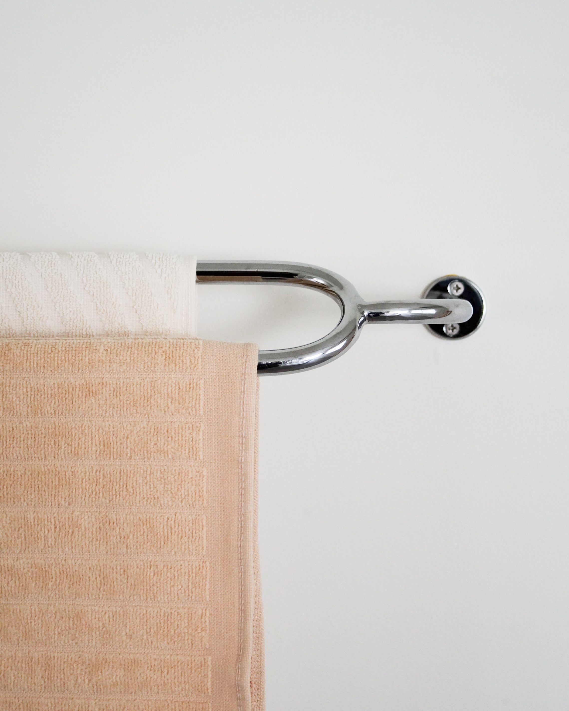 FAUNA Towel Bar Double — top view with soft beige towels hanging