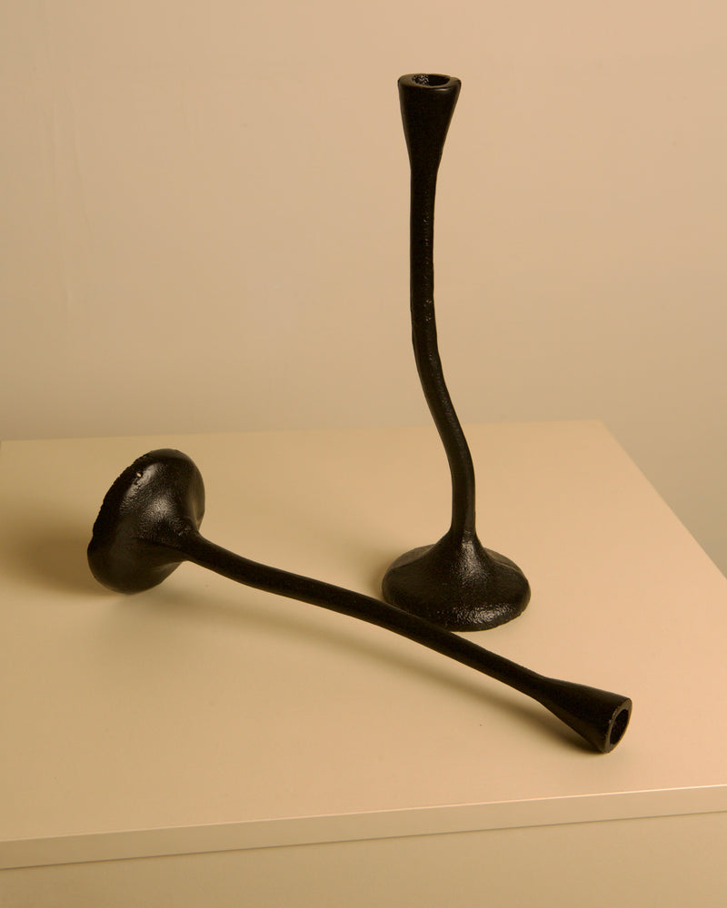 Pair of "Torsadé" Candleholders in Black Cast Aluminum from the 80s — close-up showing textured black surface on neutral back