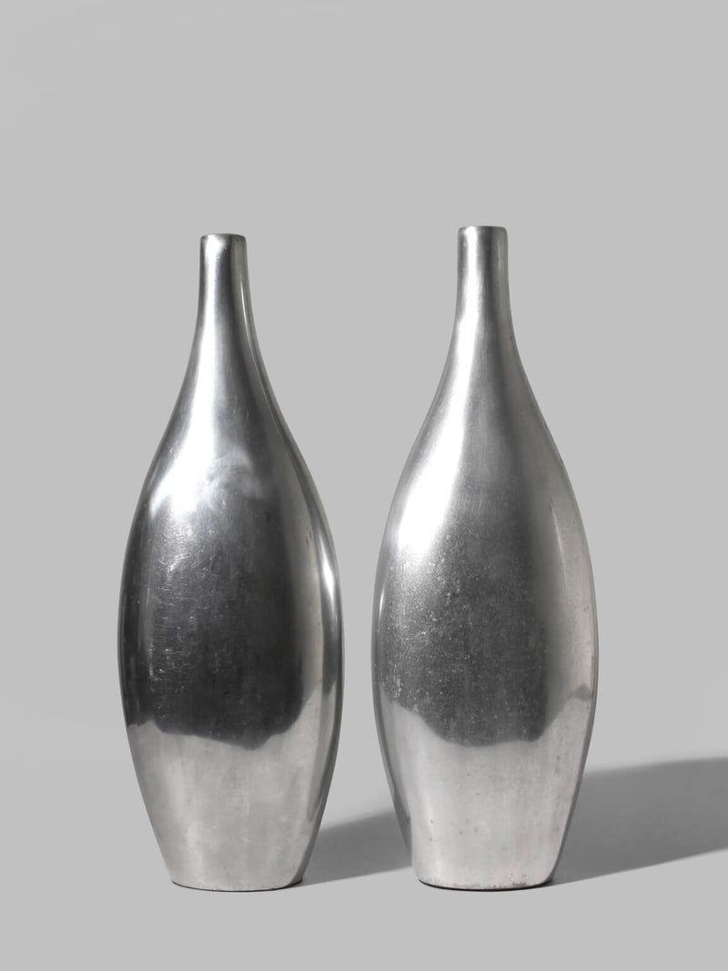Pair Of Polished Aluminum Tall Vases by Vintage Stories | The Oblist