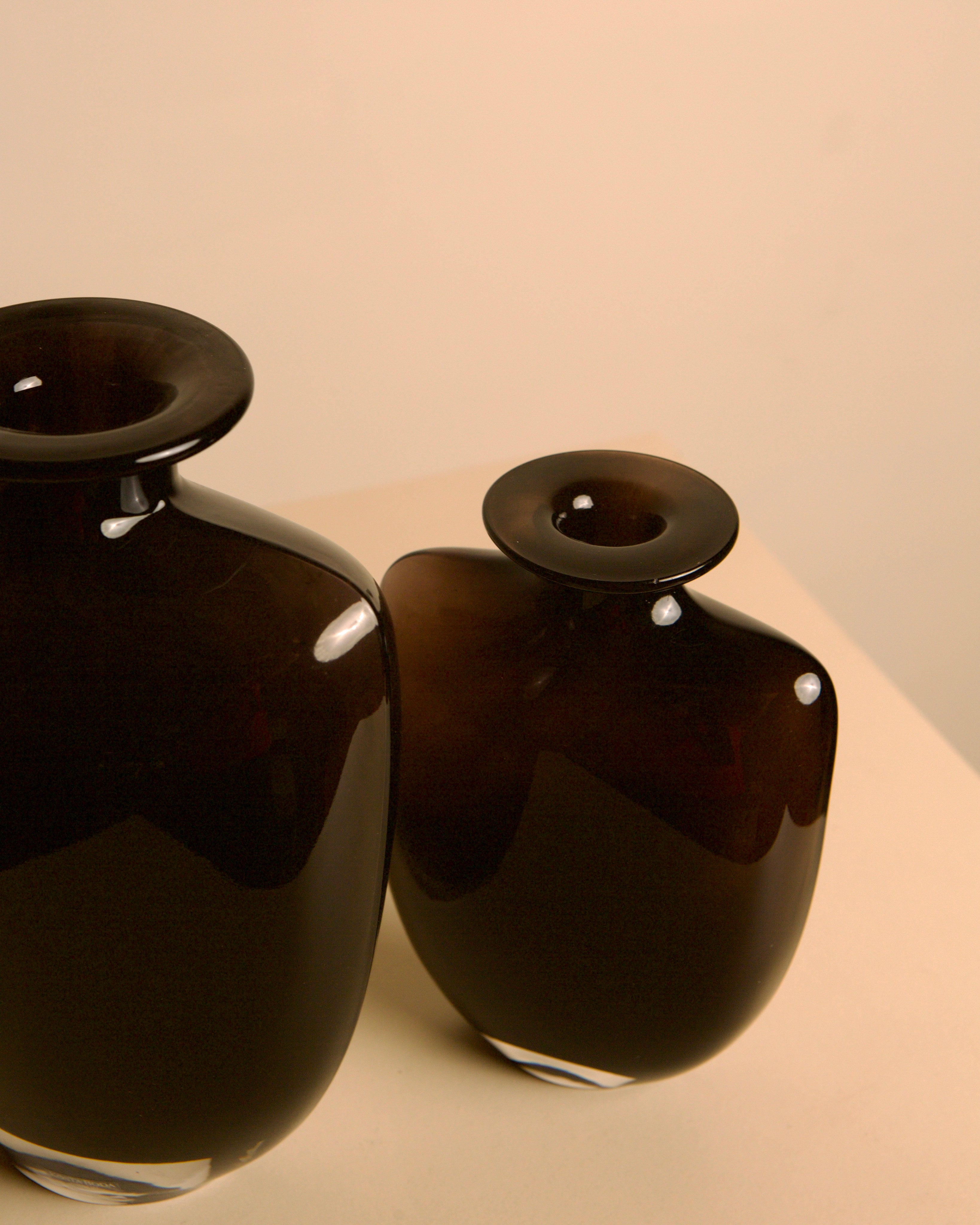 Pair of dark glass vases, Kjell Engman for Kosta Boda, Sweden, 1980s — close-up