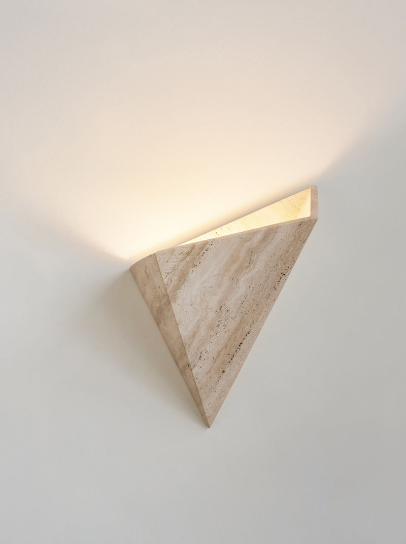 Prehistoric Travertine Wall Light — angled view highlighting light texture