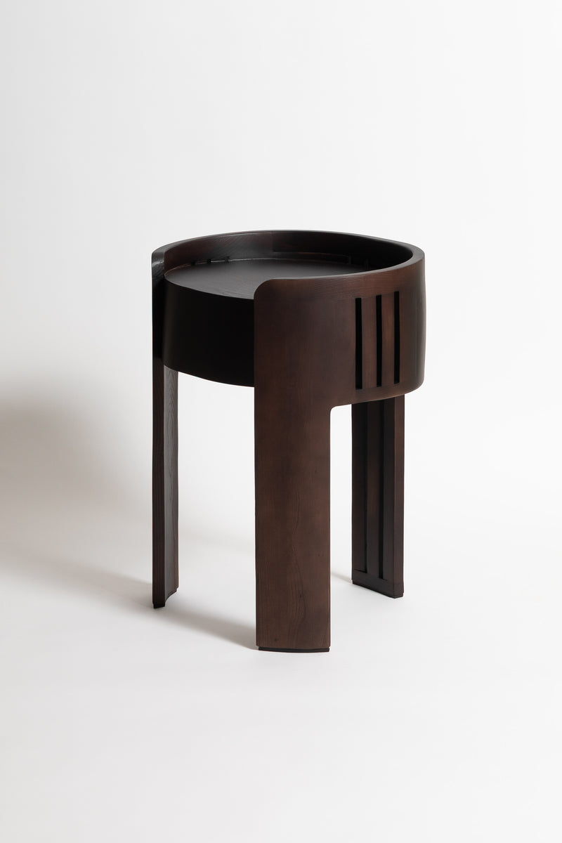 Modern nightstand with curved black and brown wood design by Tassiana Laurre