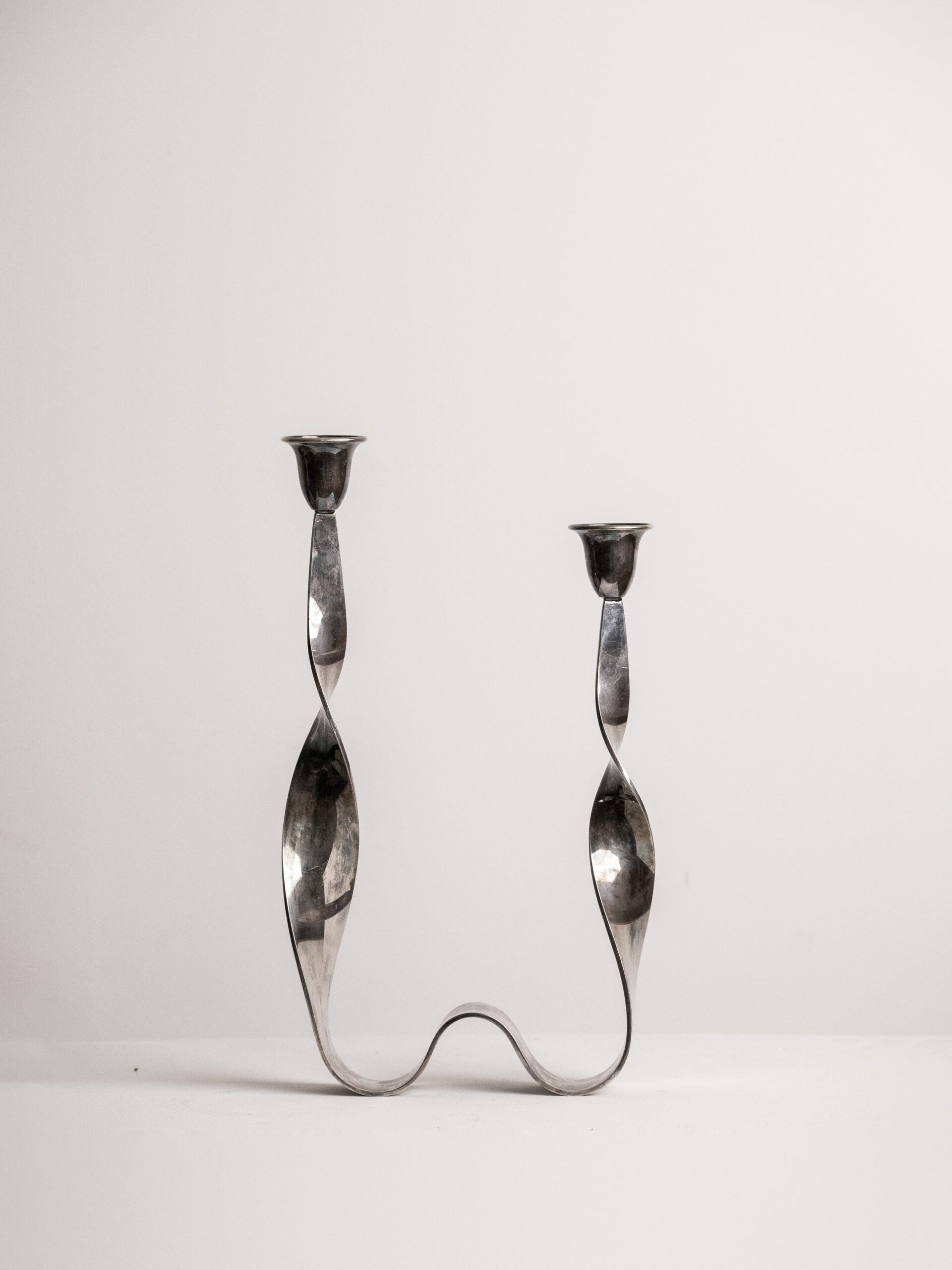 Guido Niest Cobra Candelabra, Asymmetrical Twisted Ribbon, Silver Plated, Postmodern Italy 1980s by Studio Ecubed