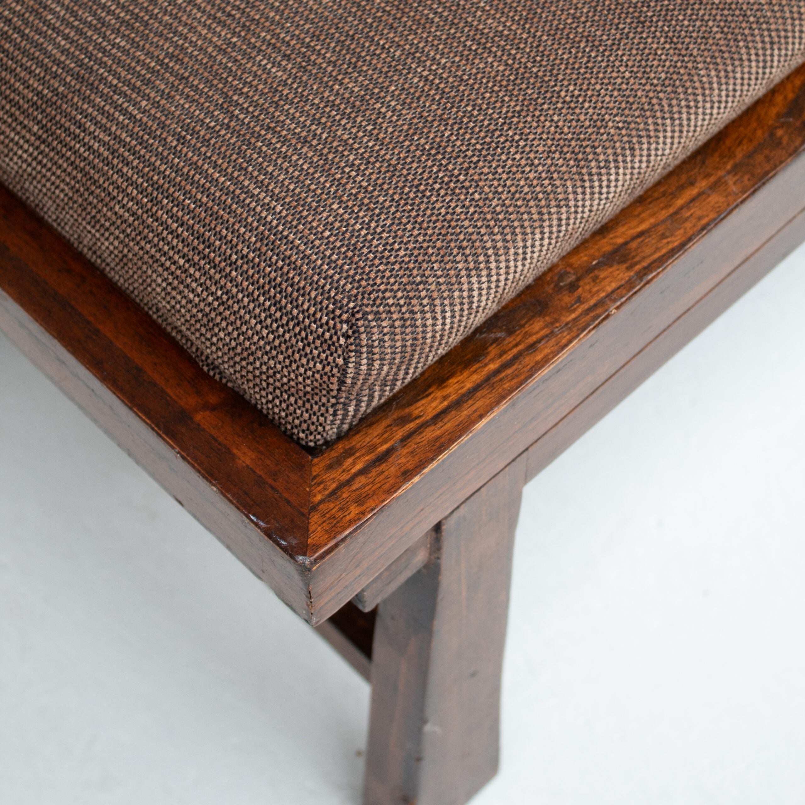 Rustique Bench in Wood with Cushion — angled view of wooden frame and brown cushion