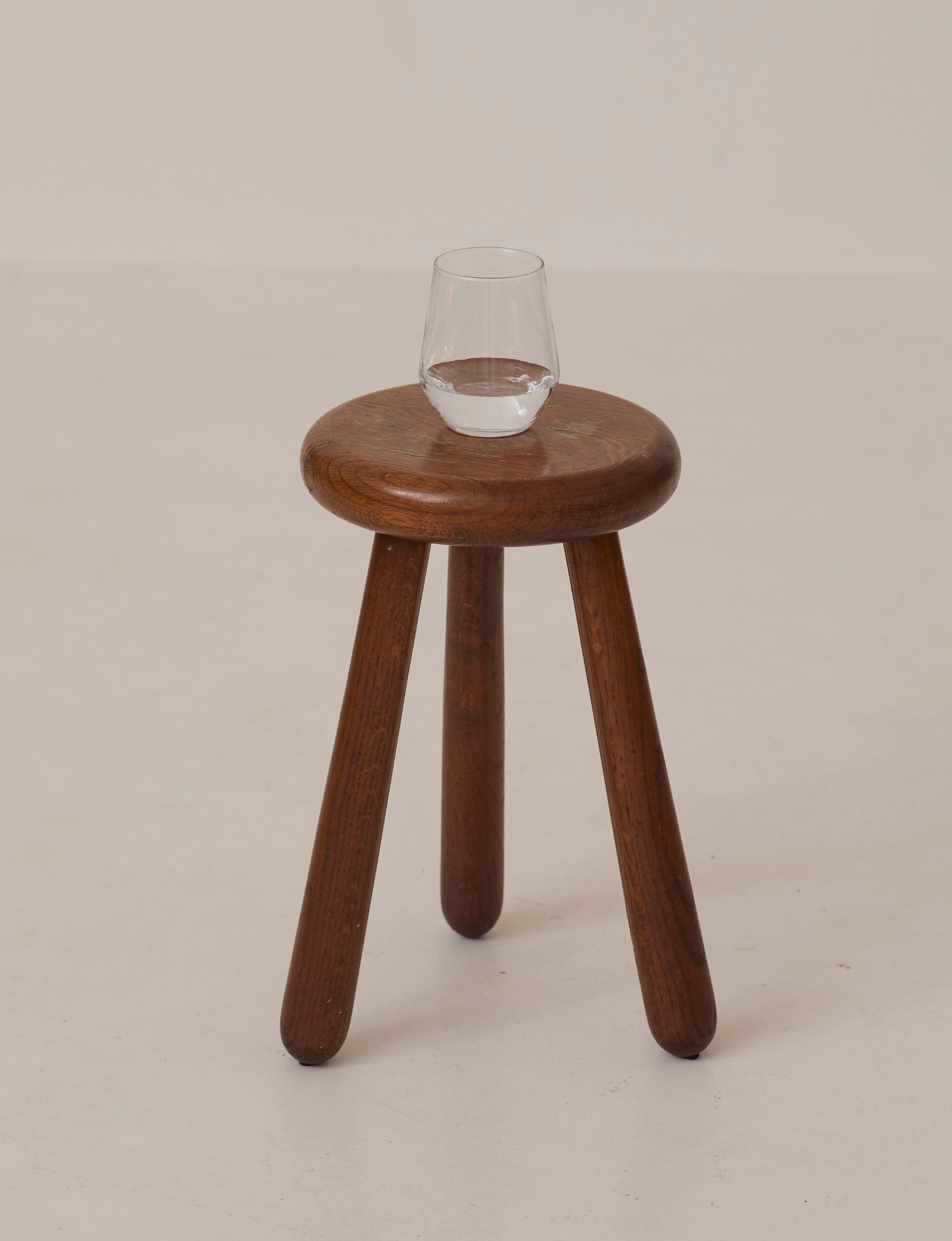 Brutalist Tripod Stool Handcrafted in Solid Oak Wood C. 1960 — front view with glass on top