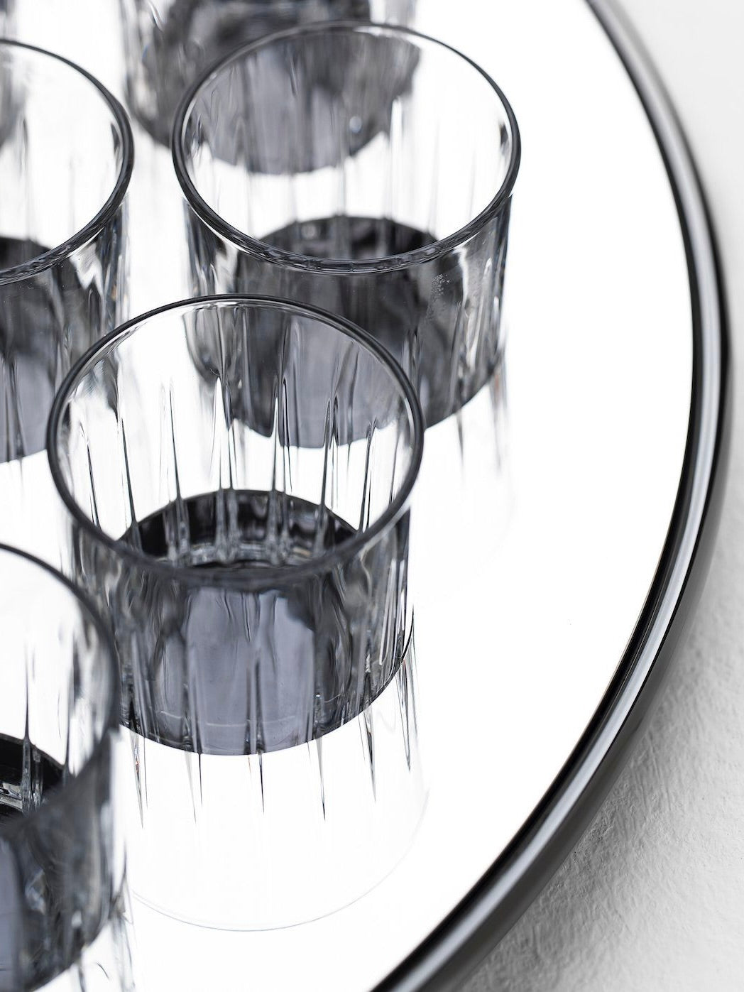 Round liquor serving set — side angle of glass cups on tray