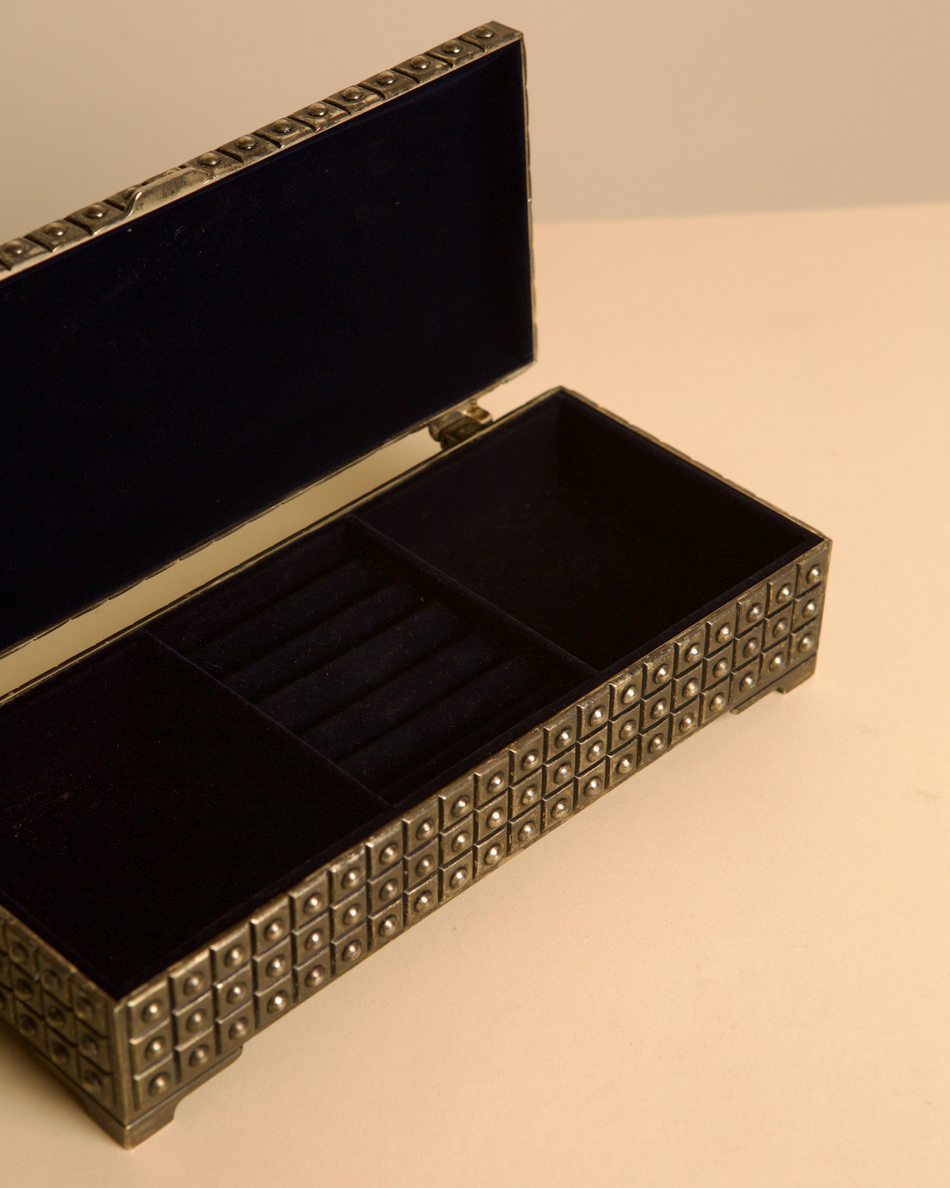 Italian studded metal jewelry box with blue velvet interior, 1950s — lifestyle setting
