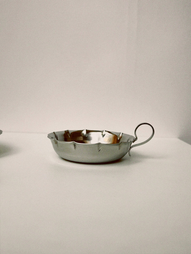 A set of 6 Manushi Traditional French silver Tastevin wine tasting cups with handles and decorative jagged edges are displayed on a plain white surface against a neutral background.