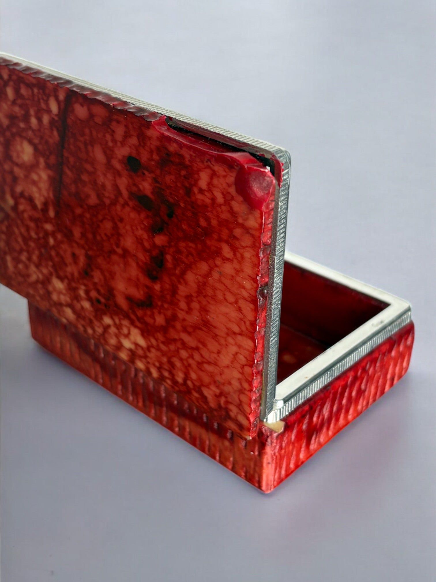 Red Faux Alabaster Box by Romano Bianchi, Italy, 1970s — side angle showing textured red surface and silver trim