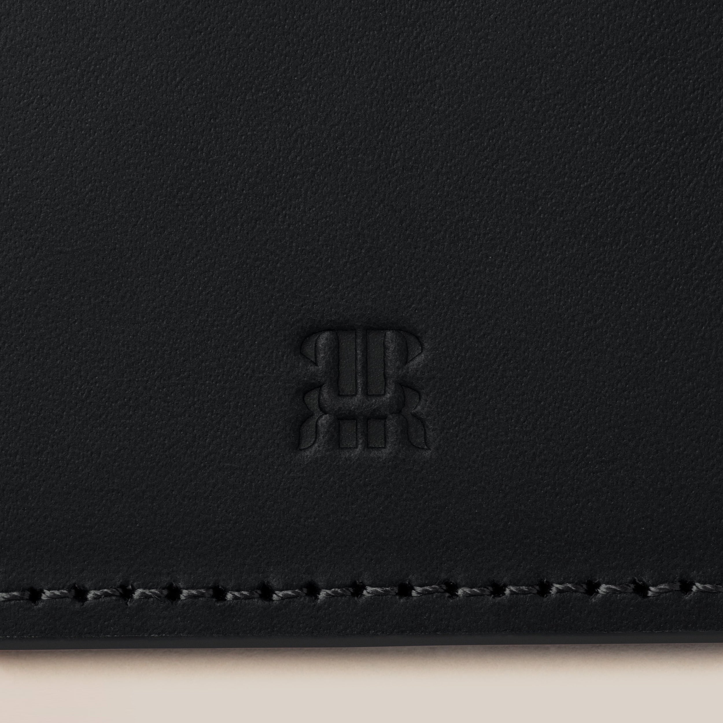 Leather Passport Holder — close-up of black leather texture