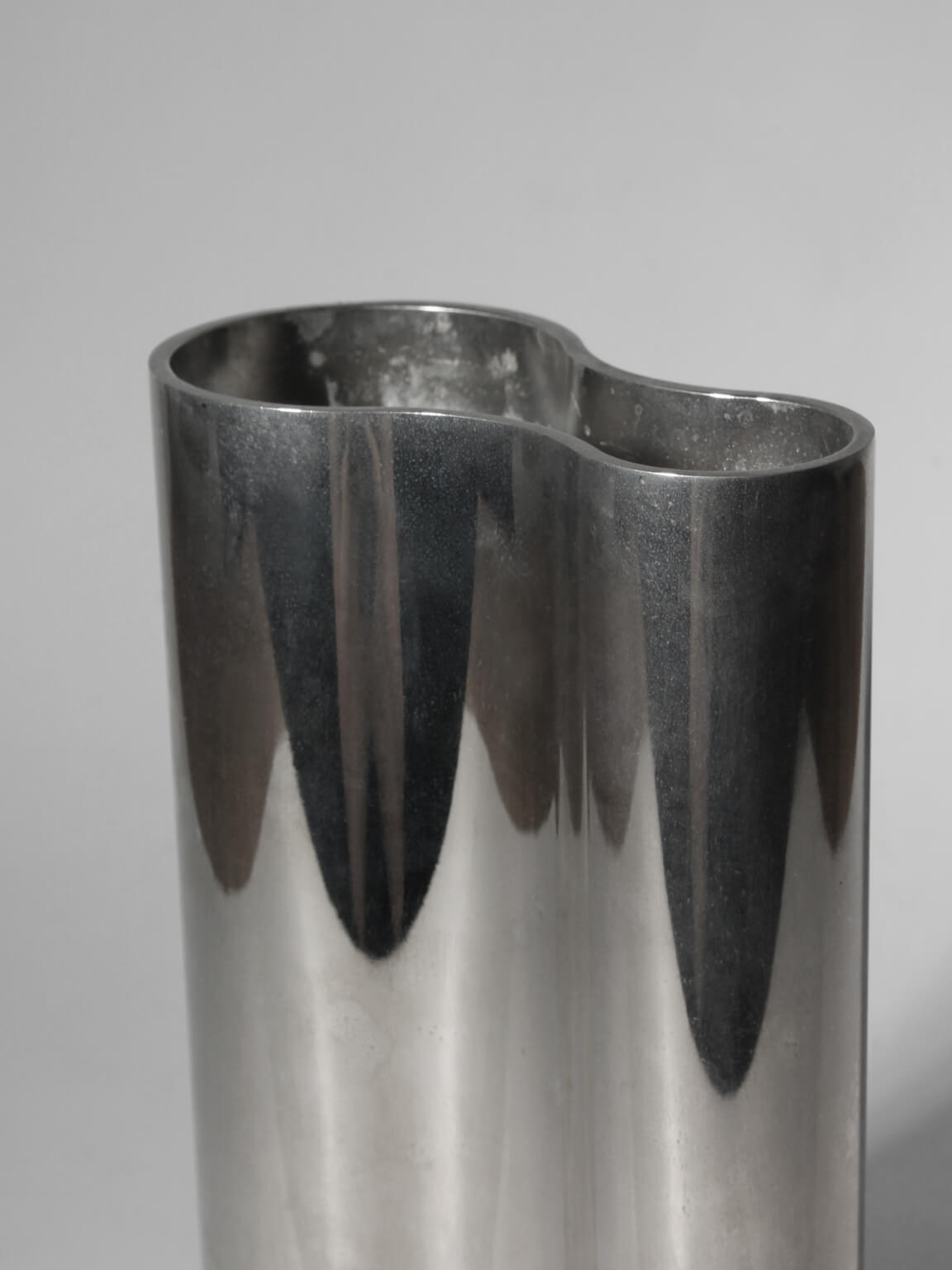 Mirrored Sculptural Stainless Steel Vase — side angle