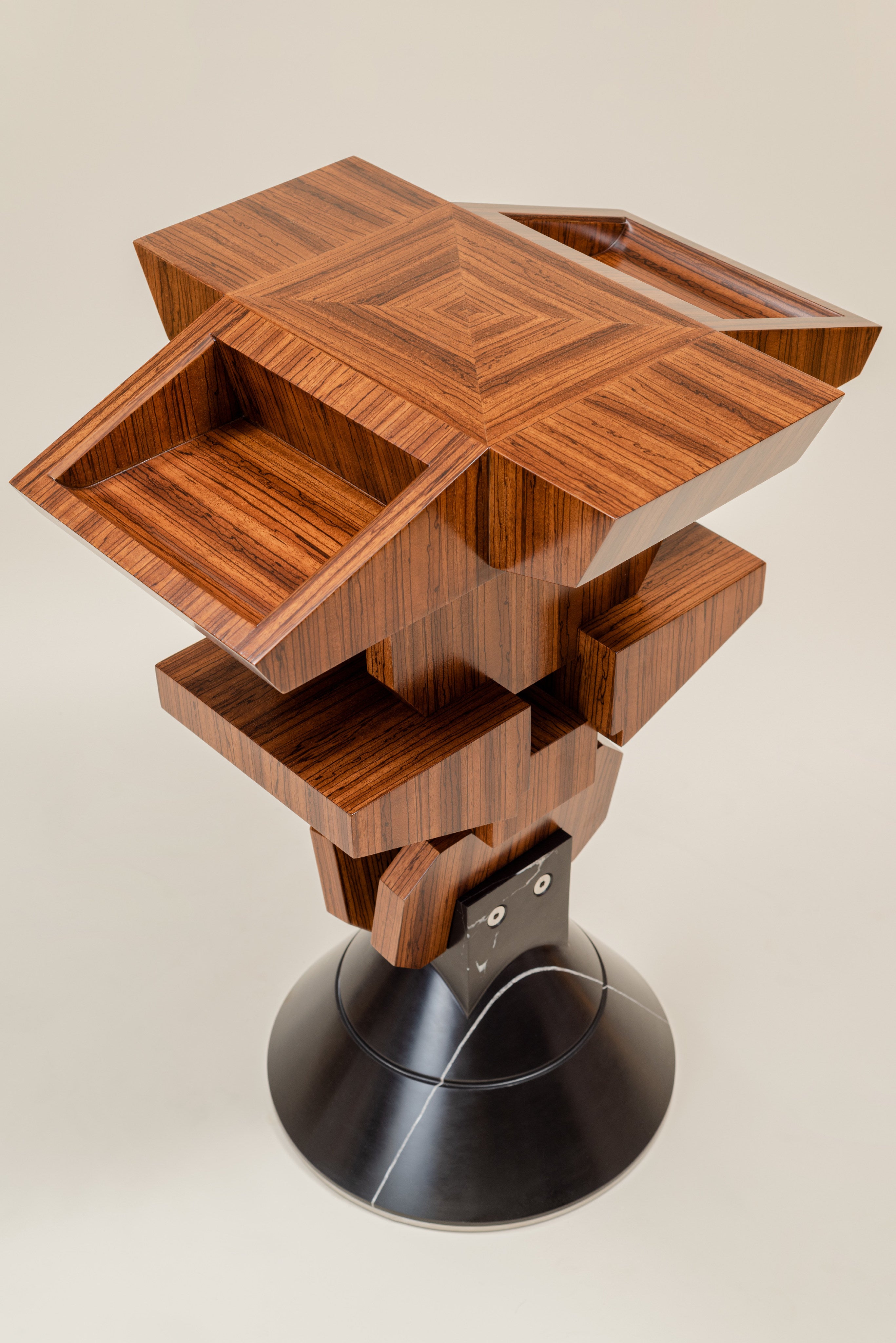 Pyramiss Pedestal Table — back view highlighting layered wood design