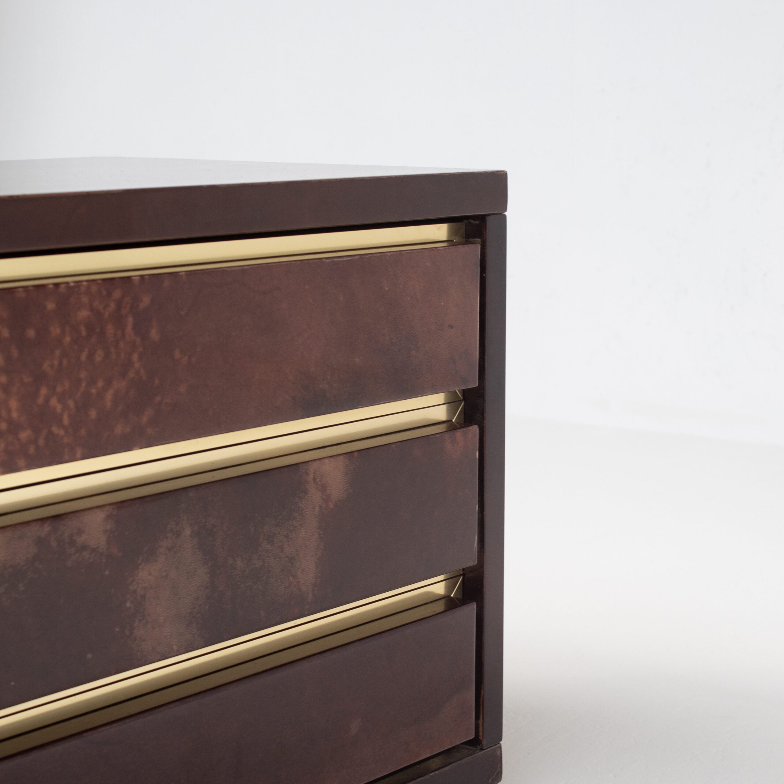 Pair of Aldo Tura (attr) Nightstands in Parchment and Brass — close-up of drawer with brass accents