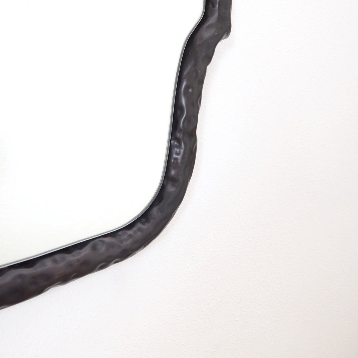 Serrallés - hammered metal mirror — lifestyle setting