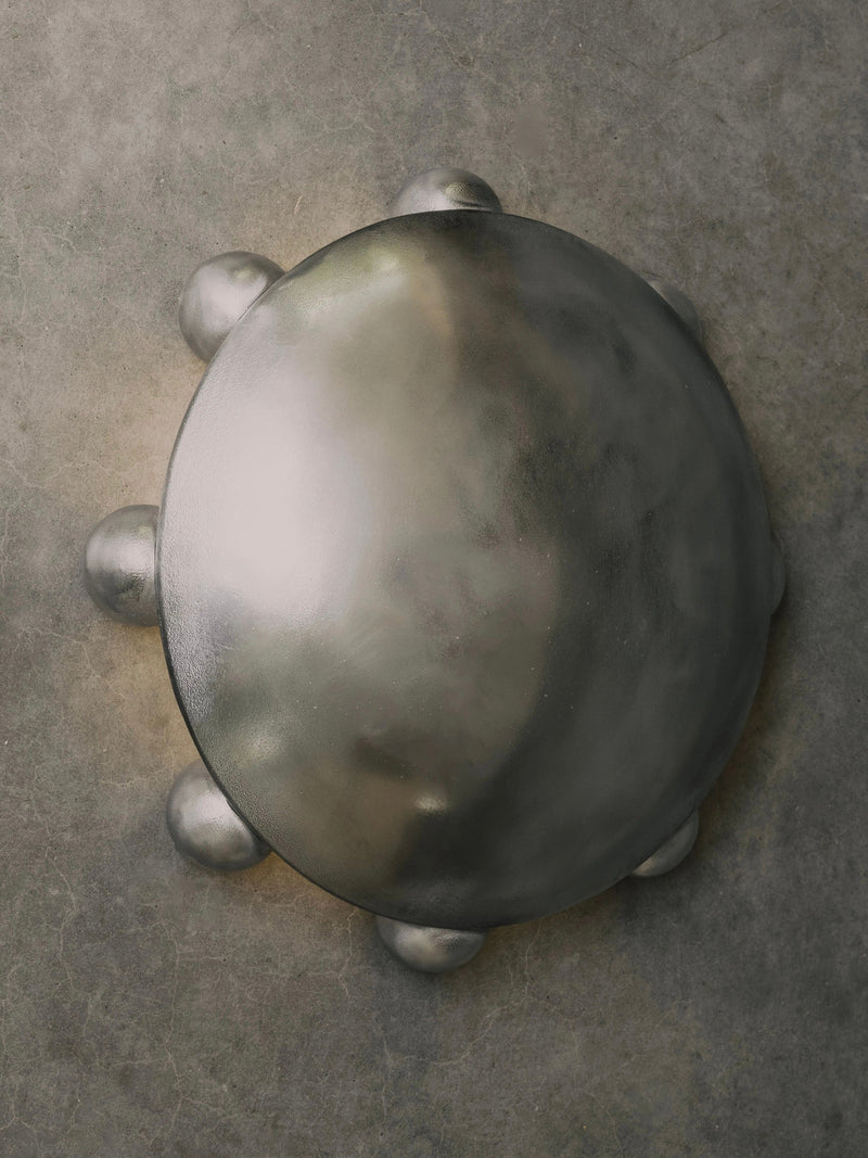 ALTER Sconce | Aluminium — top view of polished metal surface