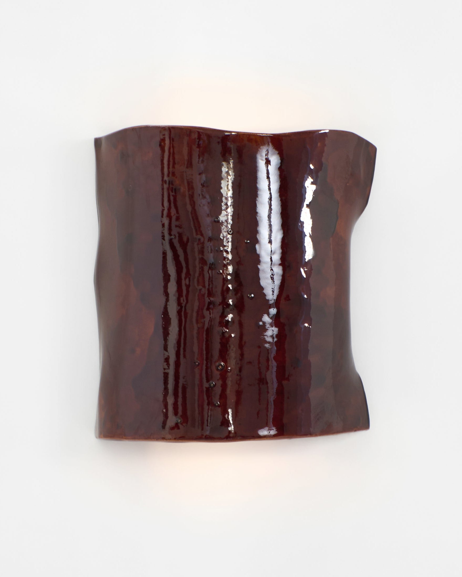 Papel Wall Light — close-up of glossy brown ceramic surface