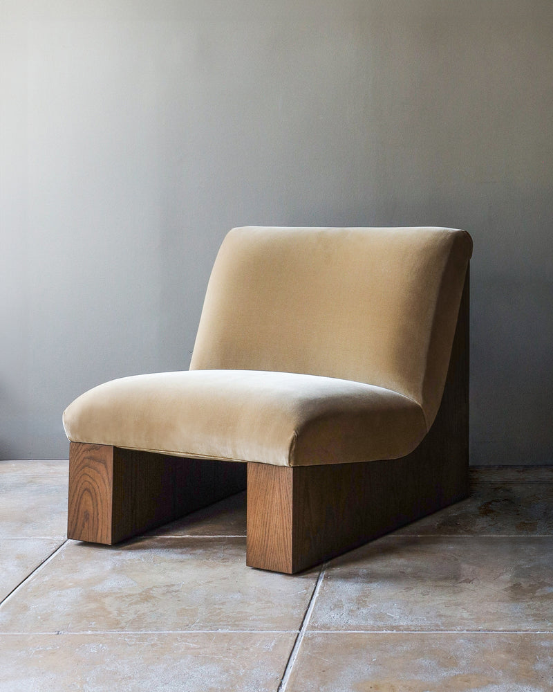 Doheny upholstered lounge chair with wood base by Studio OSKLO