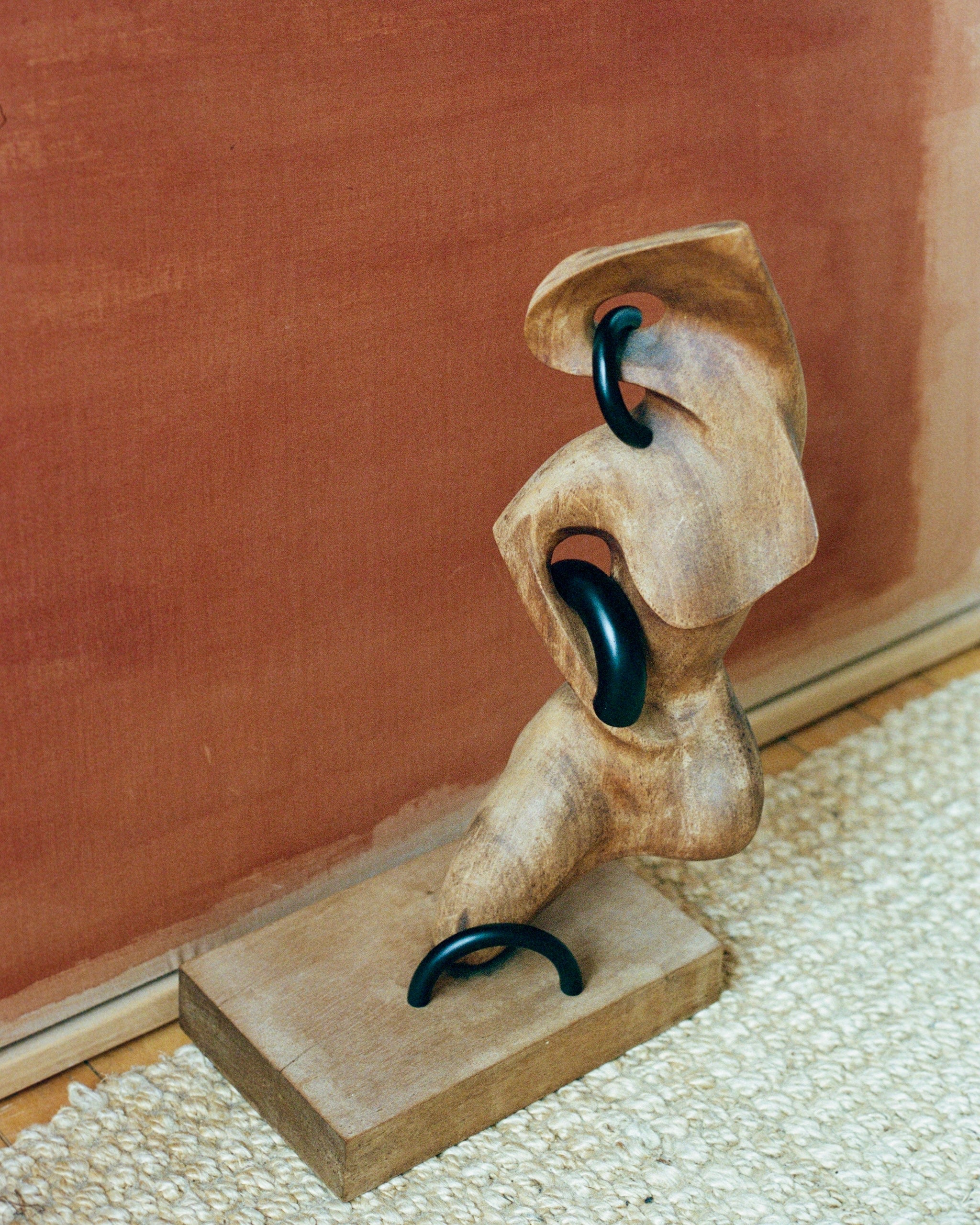 CERCLE Cabinet Pull Thick — wooden sculpture with black metal accents