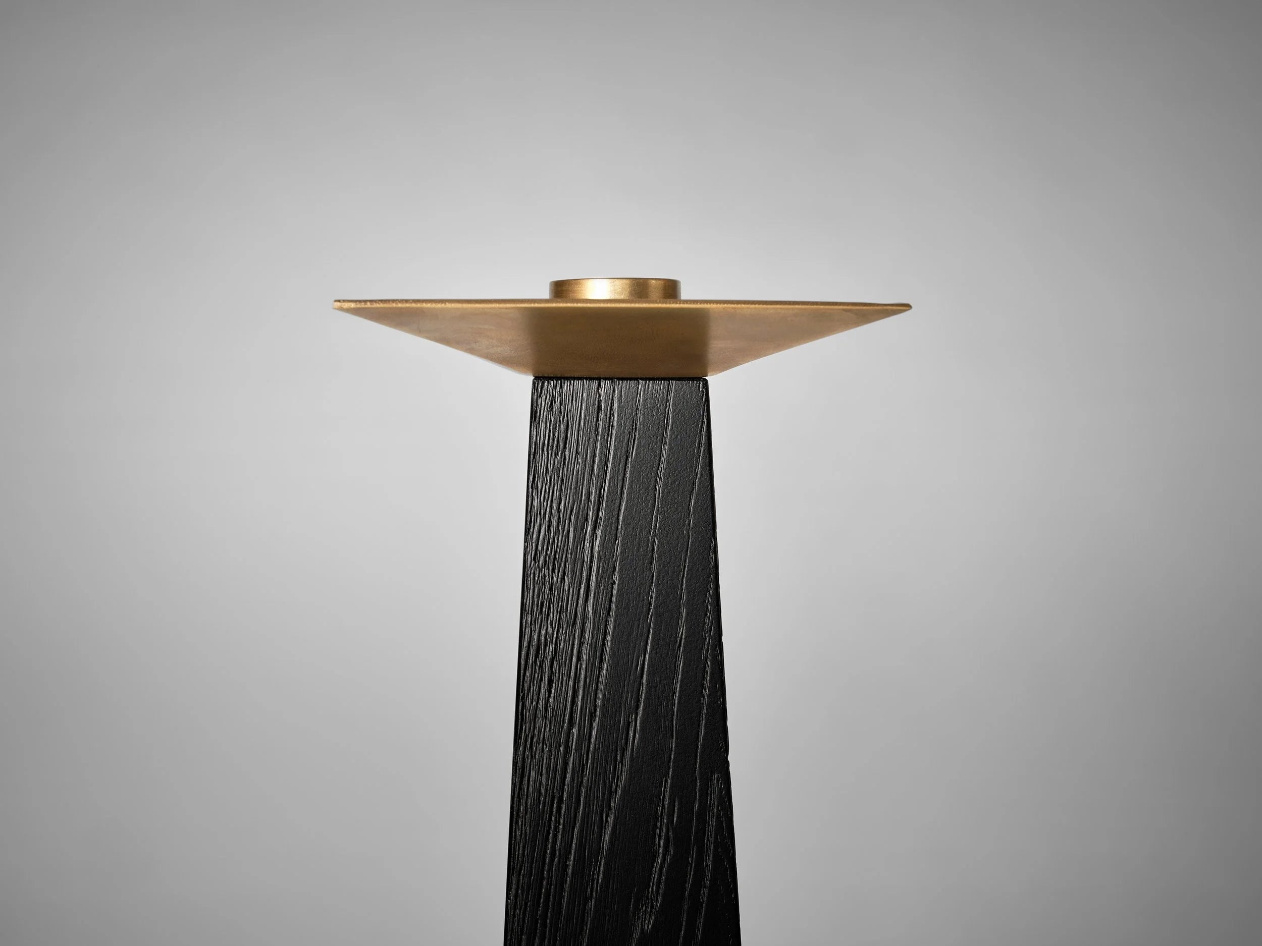 Taes Candle Holder — top view of brass holder on black base