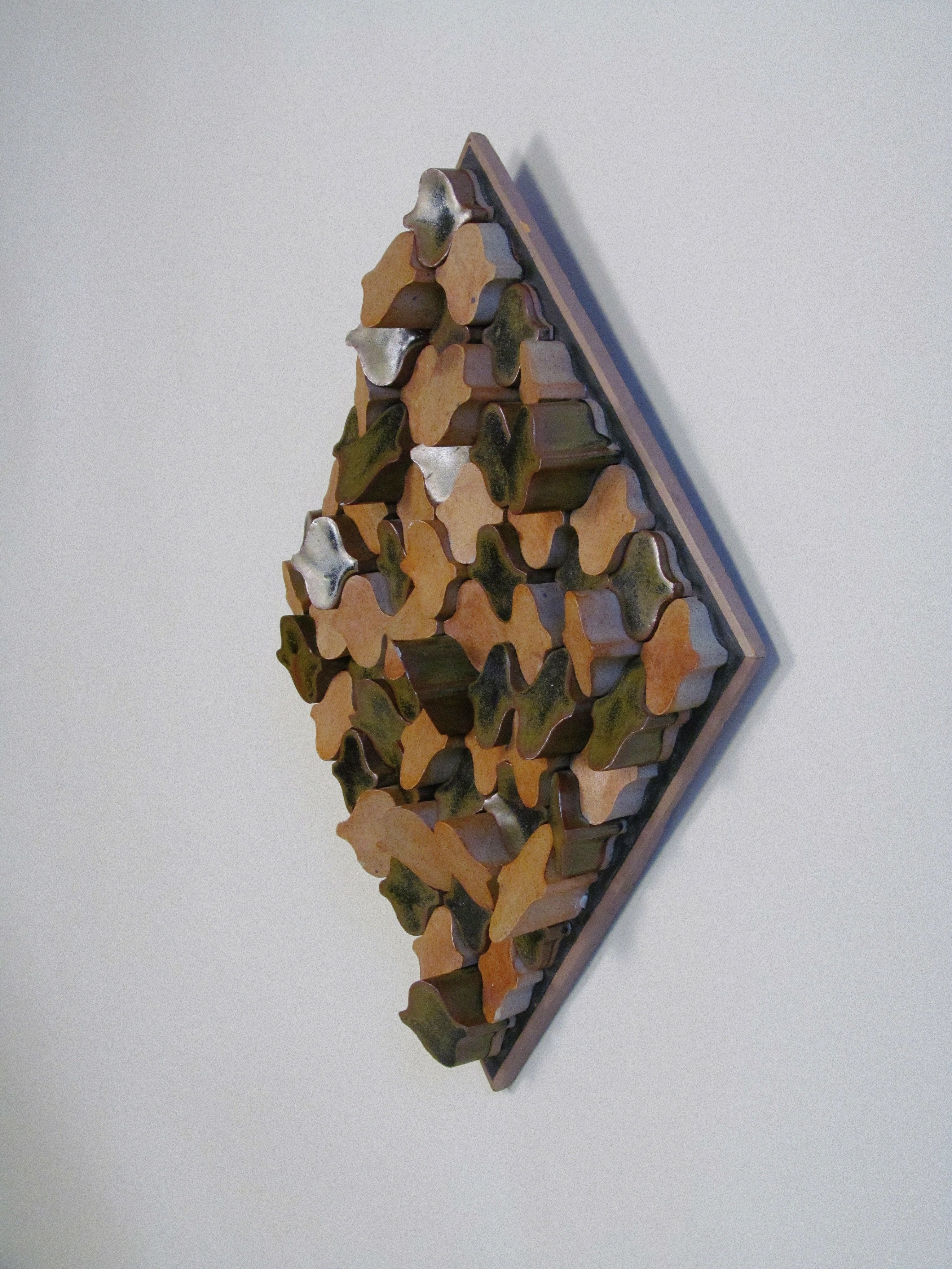 Derbyshire School of Art Ceramic Wall Plaque with Original Case c.1970 — angled view highlighting earthy tones and textures