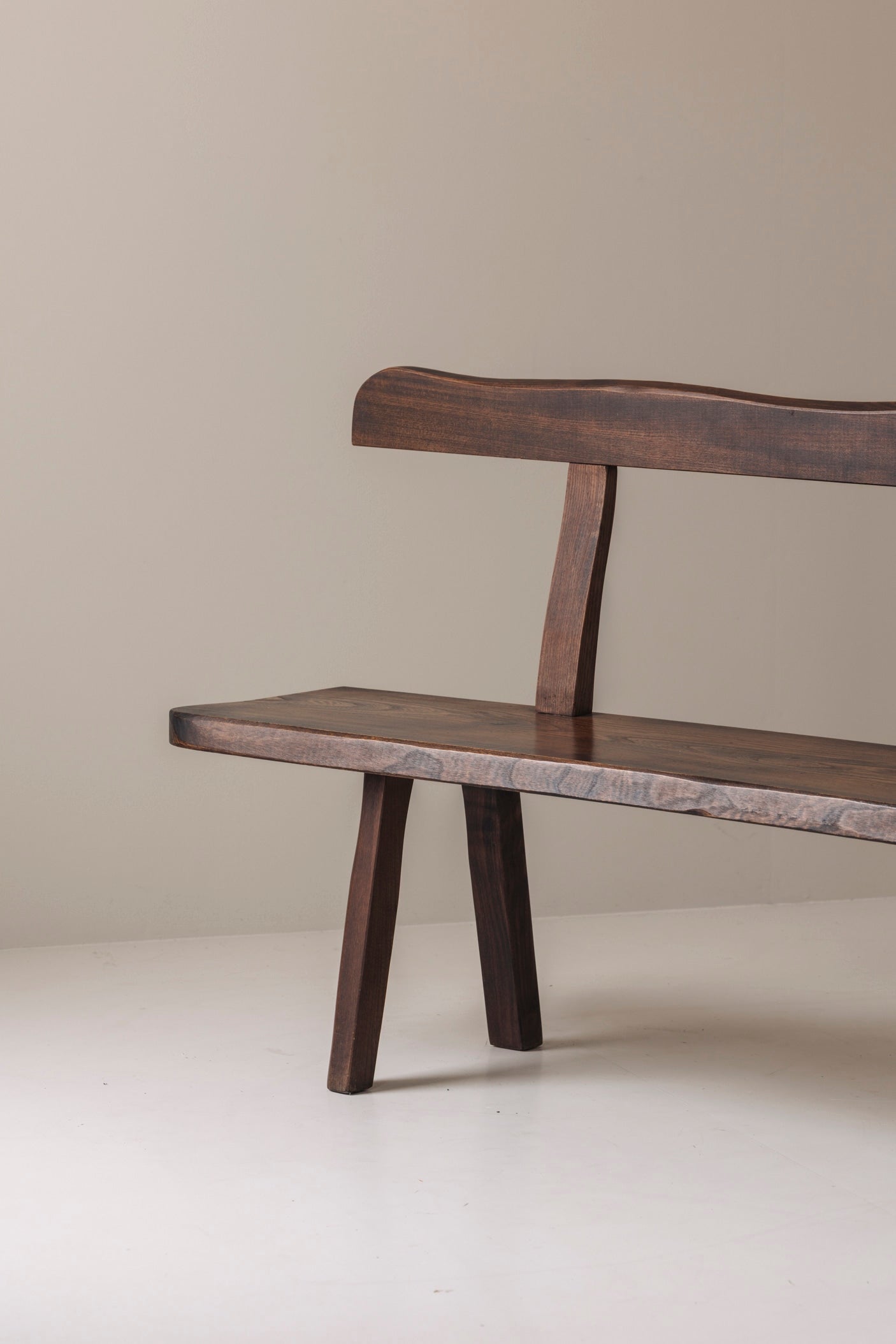 Sculptural Bench by Olavi Hanninen for Aranjou, France 1950s — angled view of dark wood seat