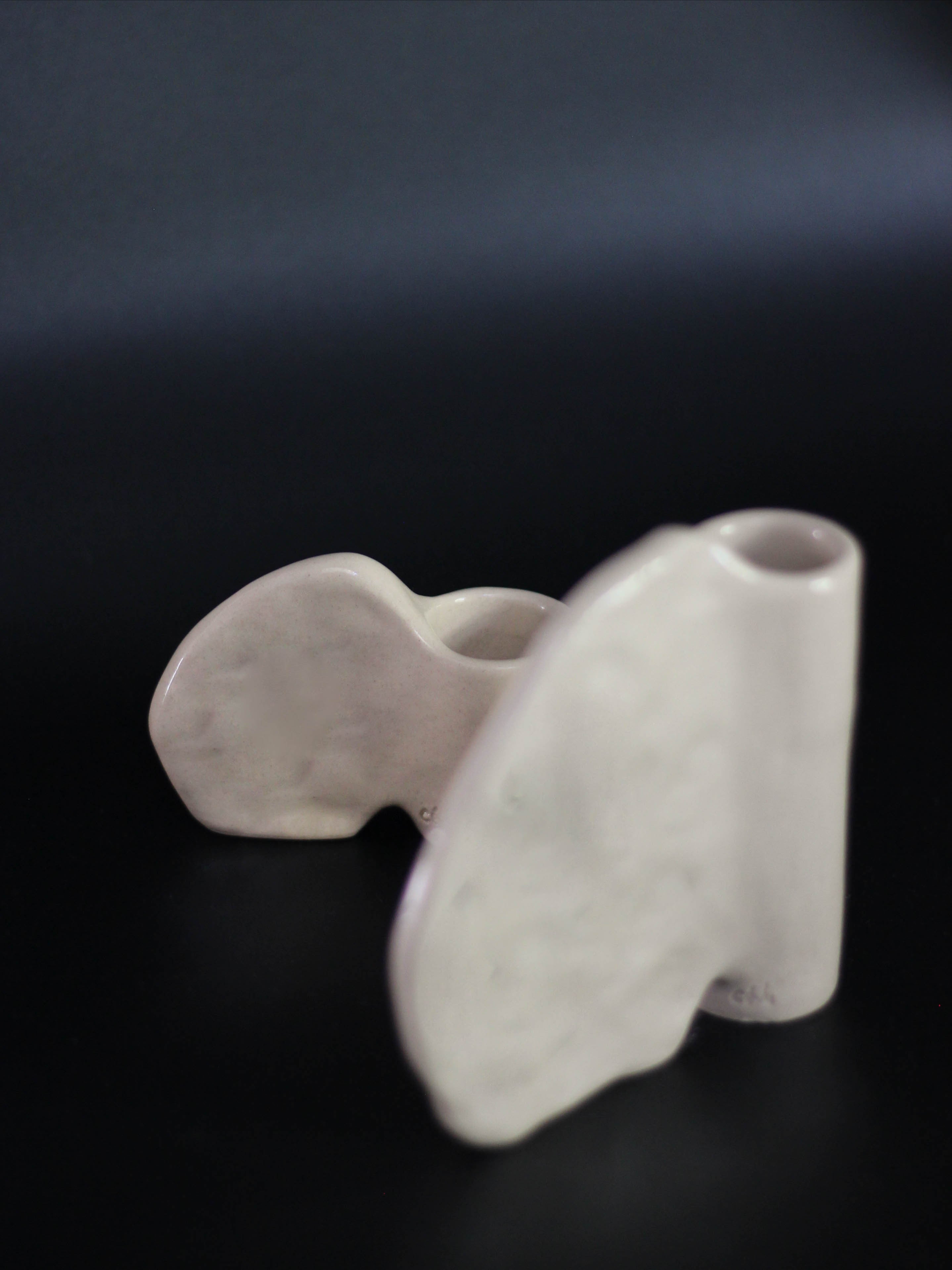 Candleholder in Stoneware with wing — angled view highlighting textured surface