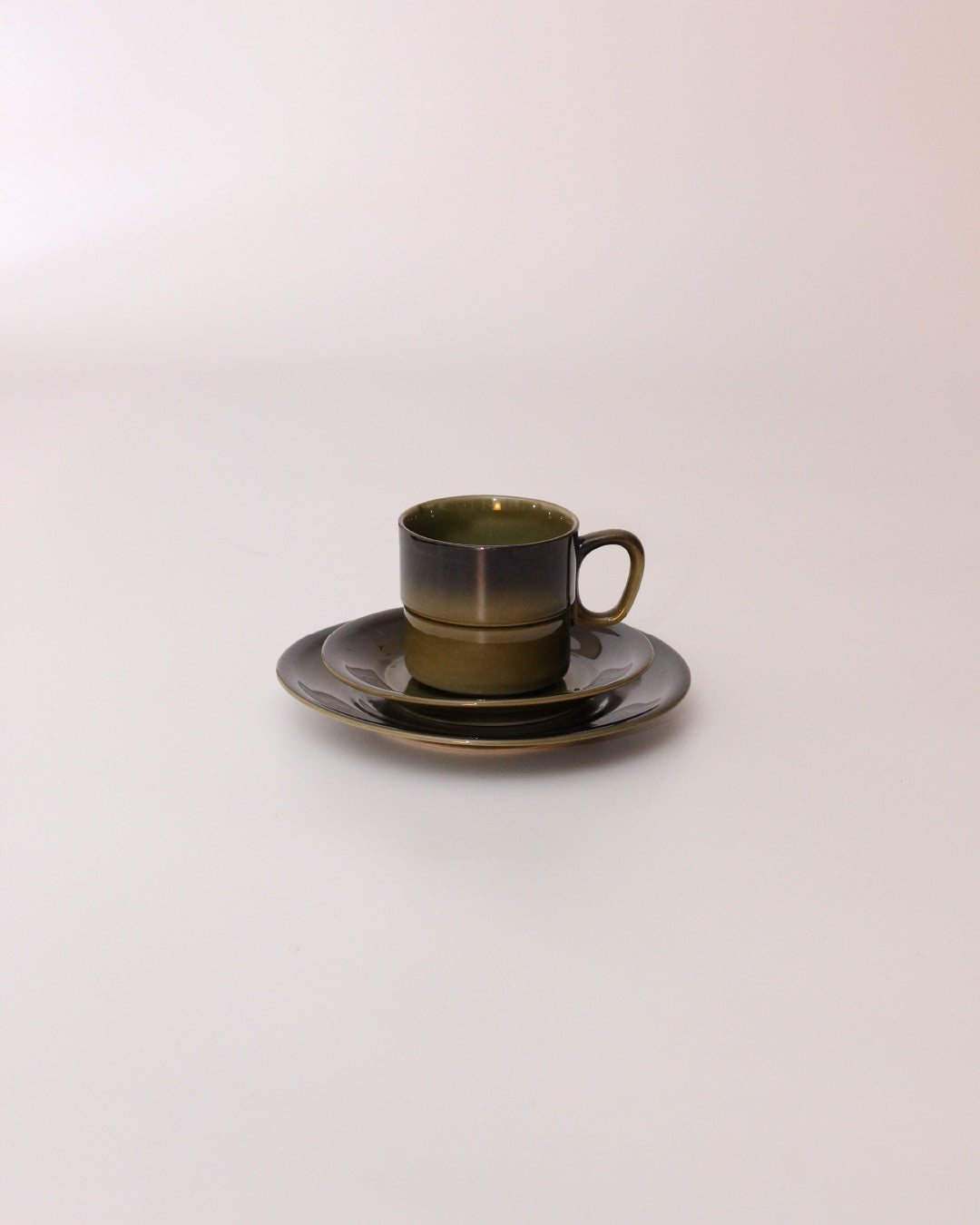 Set of Four Ceramic Cups — side view on neutral background