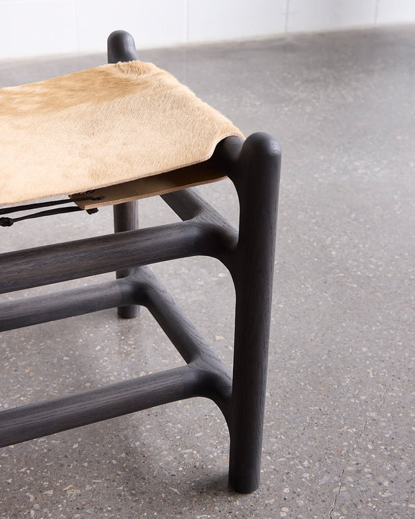 2-Seater Hair on Hide Lyndoe Bench — side angle showing dark wooden frame