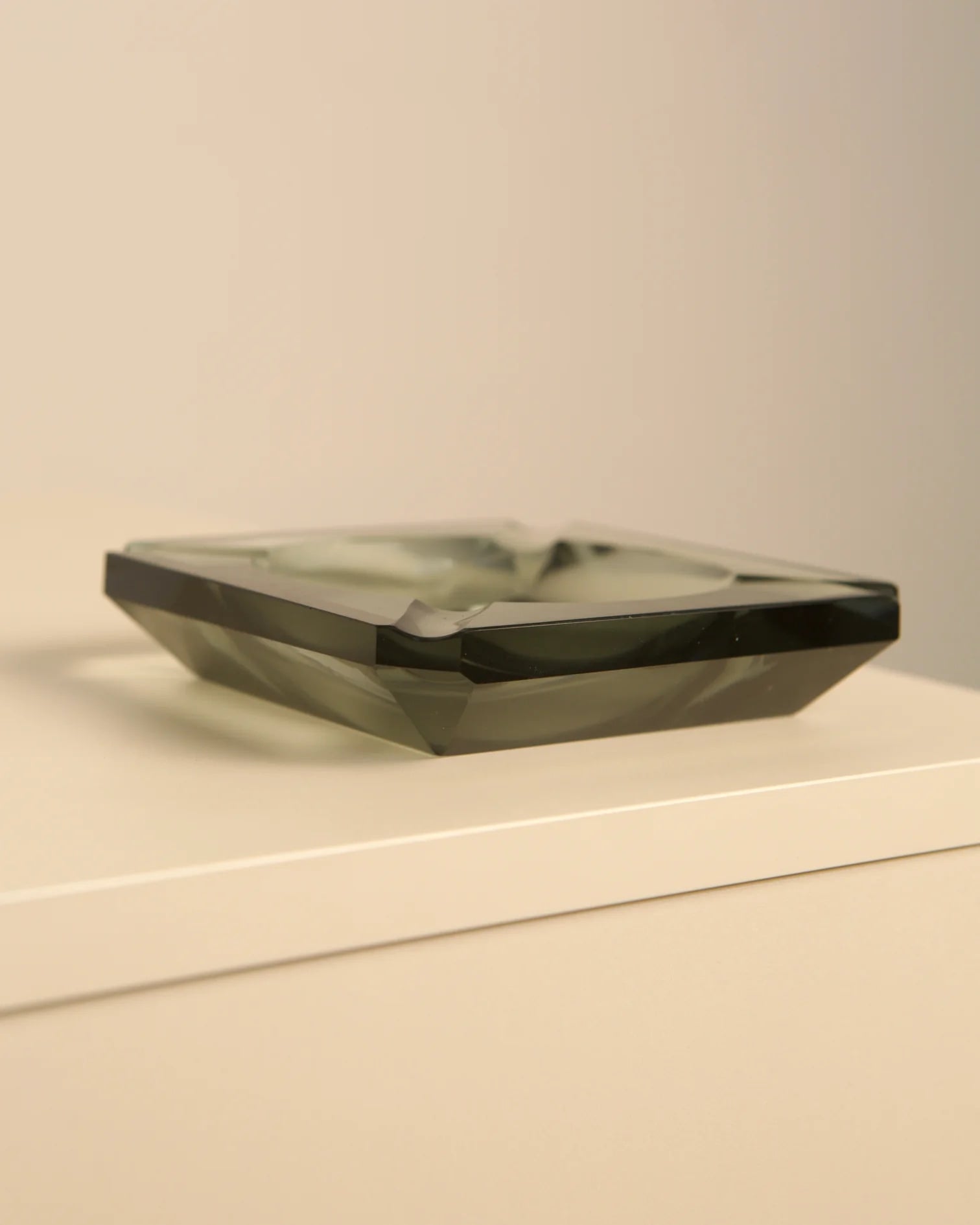 Teal glass octagonal ashtray by Fontana Arte profile view