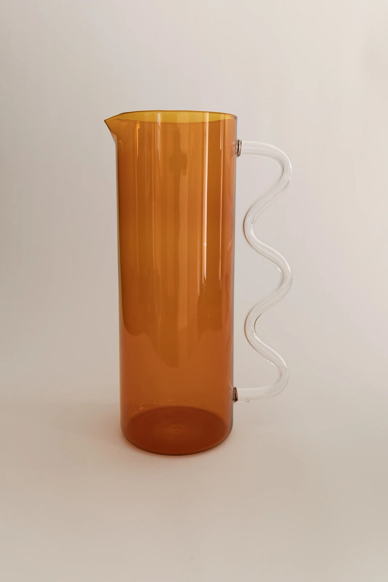 Wave Pitcher — side view of amber plastic with clear handle
