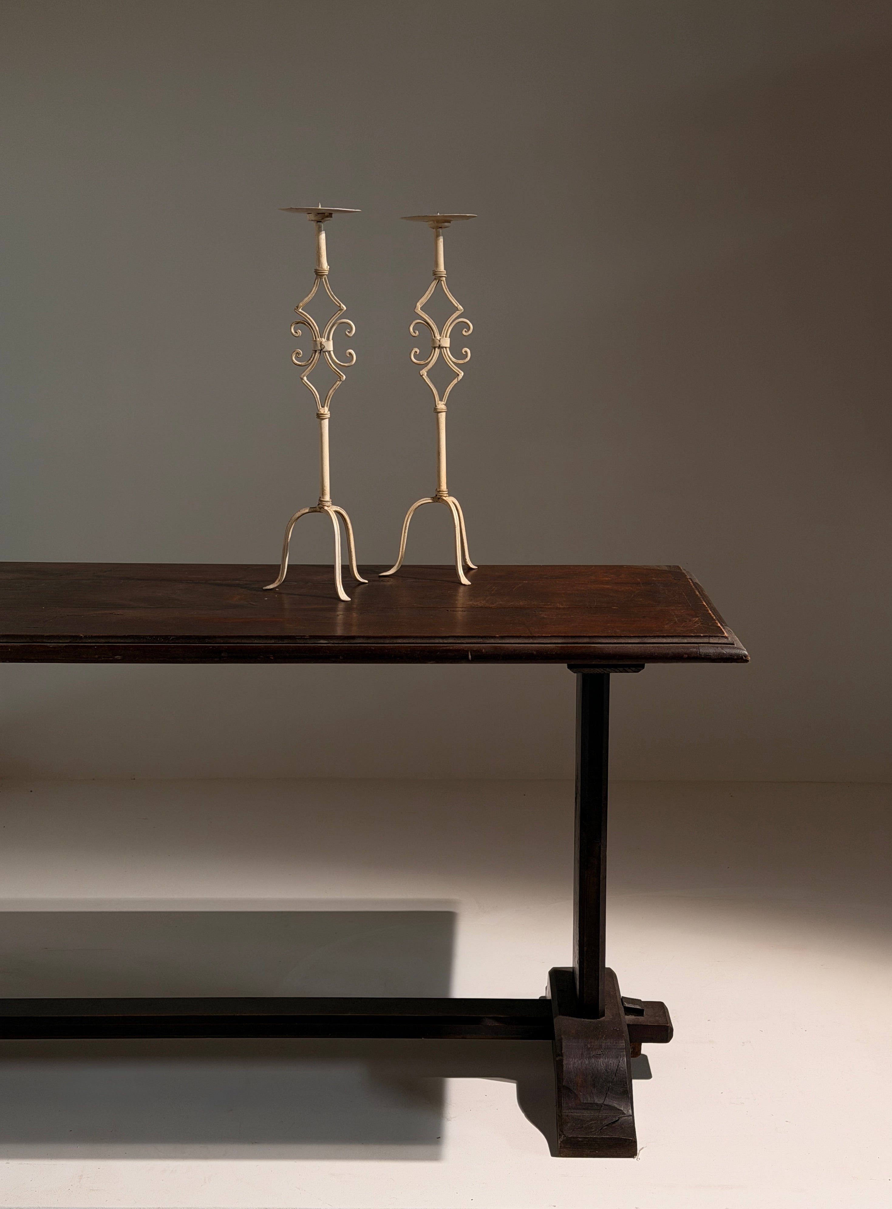 Pair of large cream-painted wrought-iron pricket candlesticks, Italy — detail view