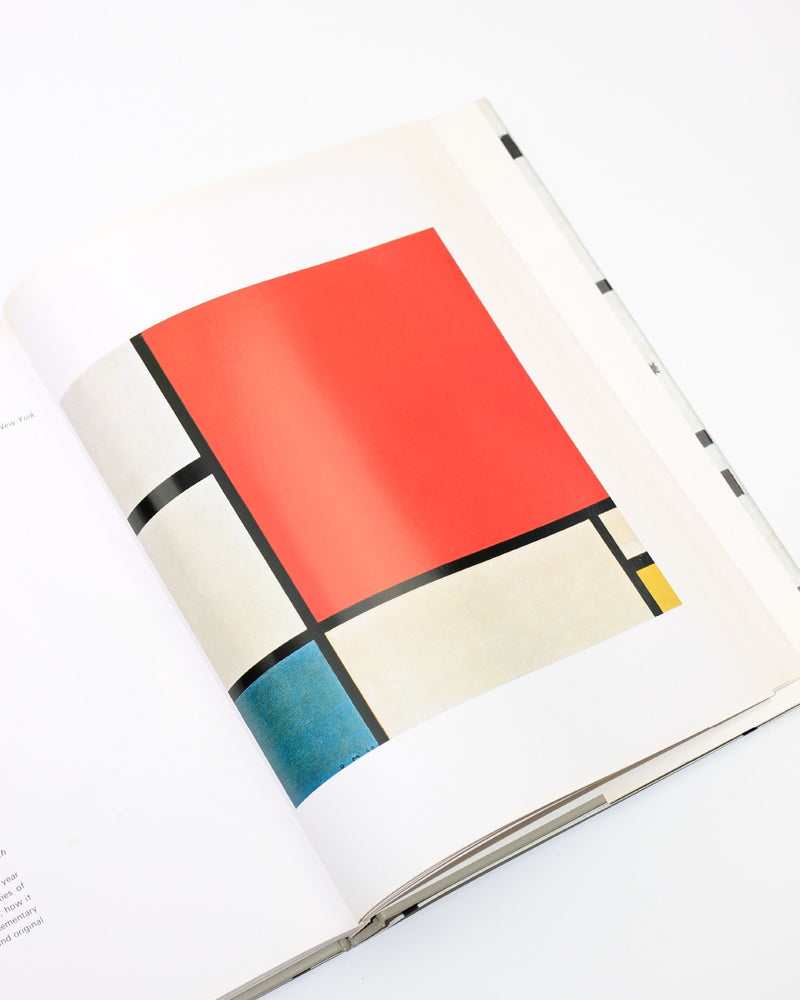 Mondrian — close-up of art book page with red and blue colors